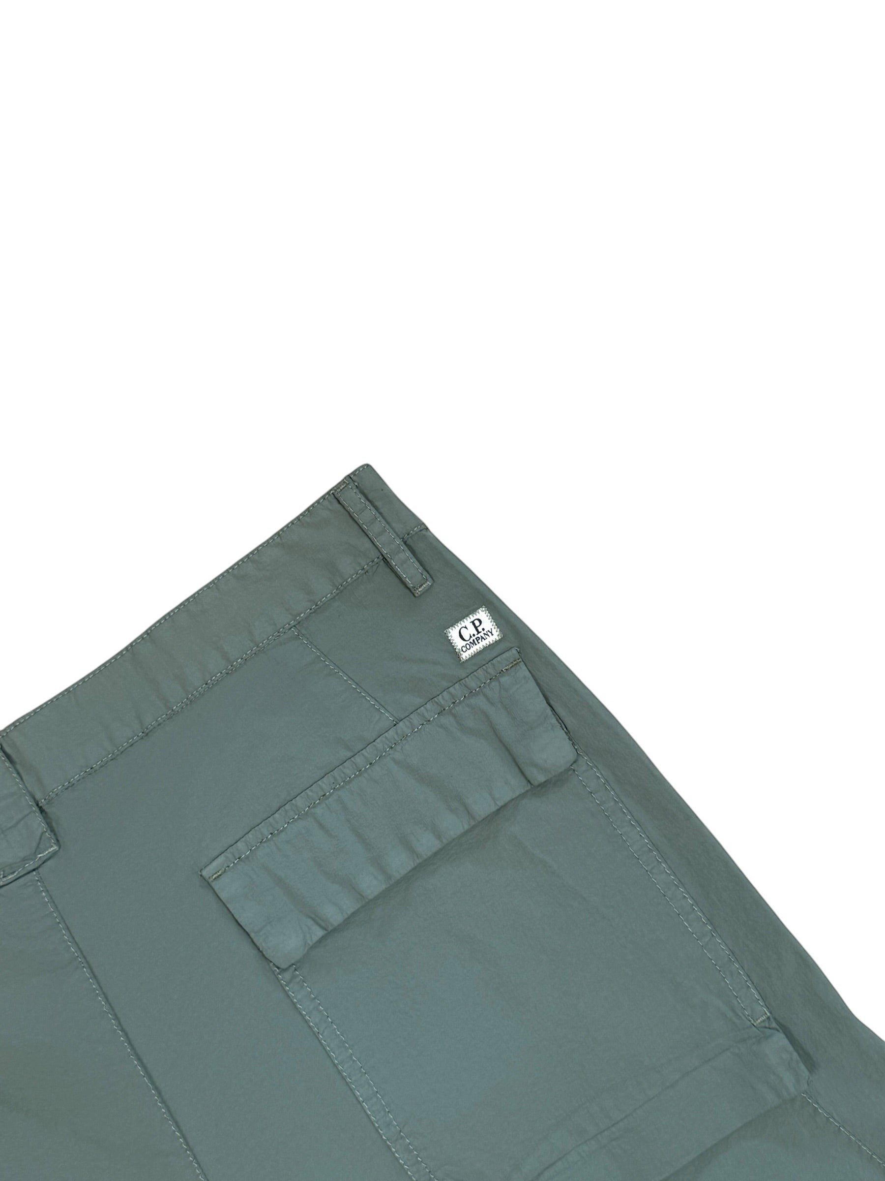 Archive No. 9 C.P. Company dark turquoise lightweight nylon cargo trousers with iconic lens detail and baggy fit.