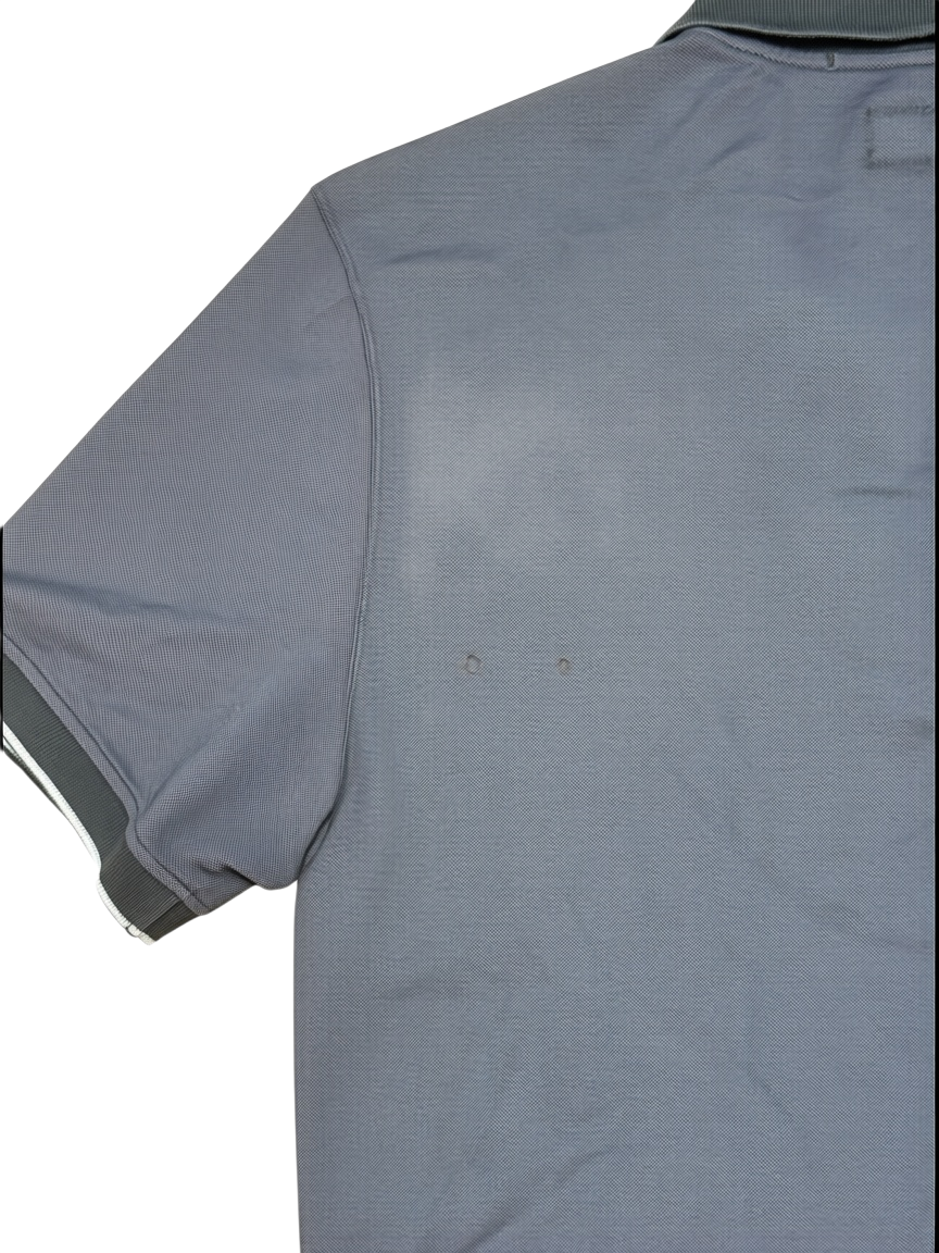 Archive No.9 C.P.Company black cotton polo shirt showing two small holes on the back fabric