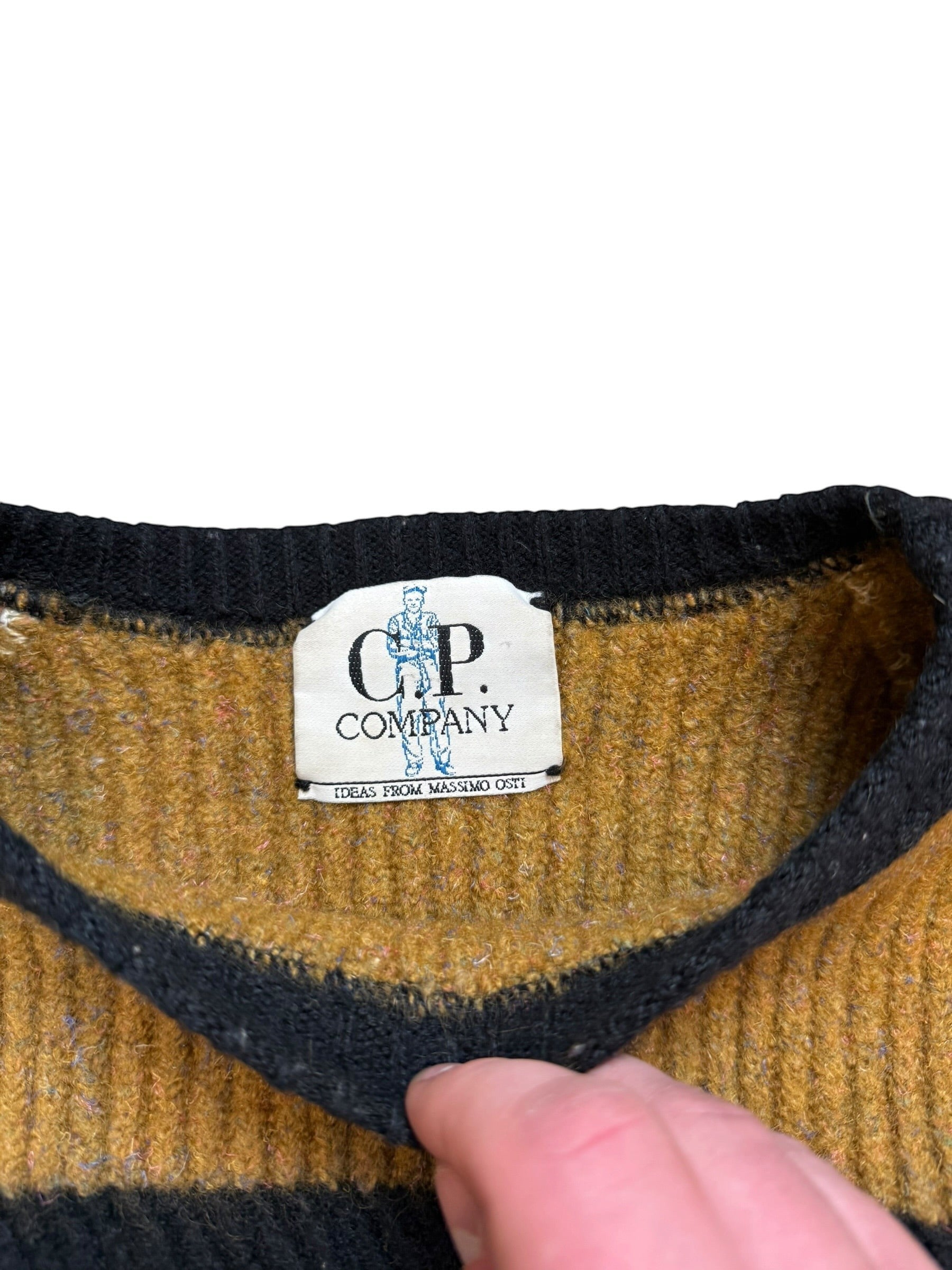 Archive No. 9 vintage C.P. Company knit jumper in beige, tan, and brown stripes with black trim. Iconic 90s design.
