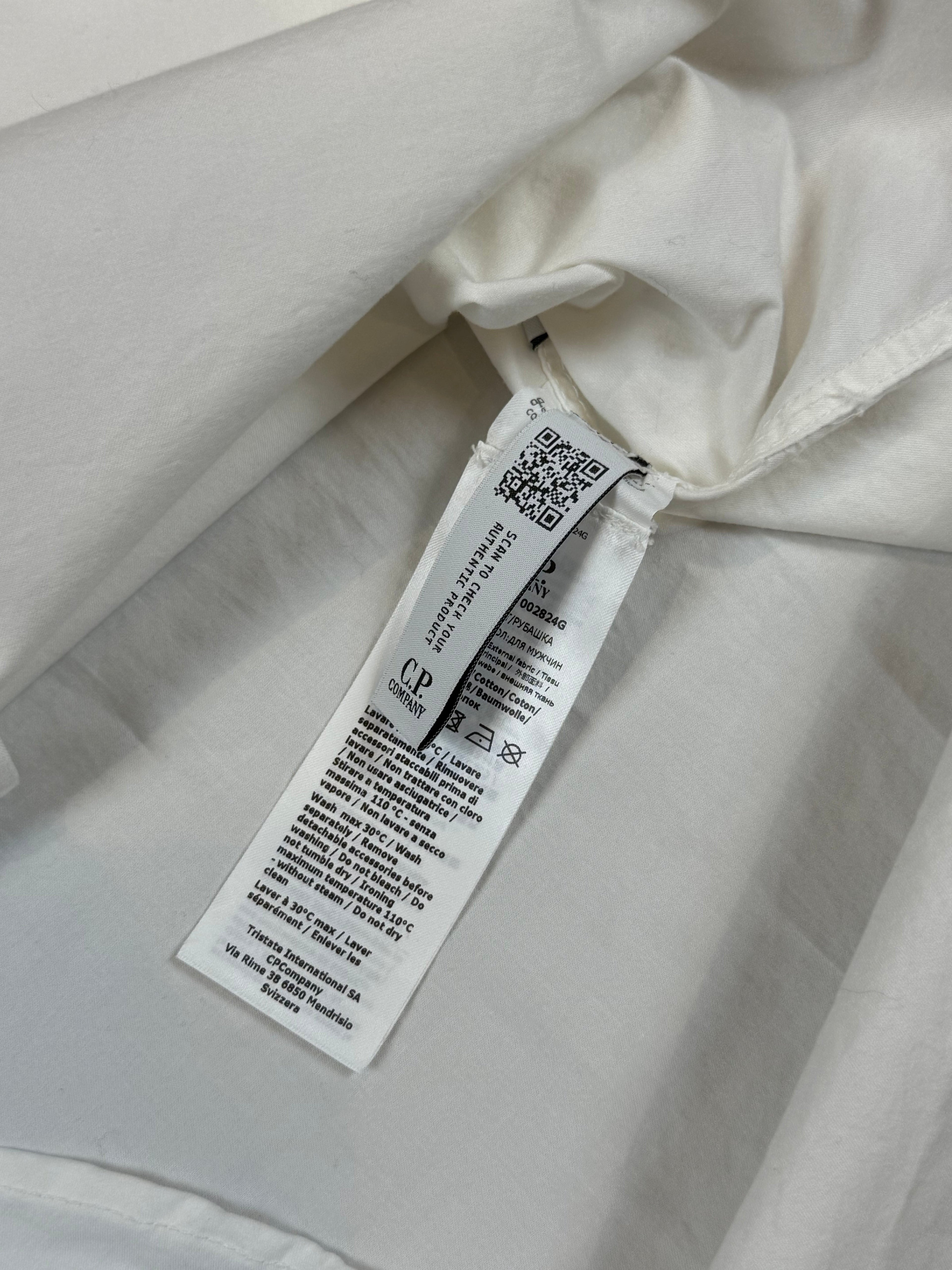 Archive No. 9 white C.P. Company lightweight zip-up overshirt, size L, with iconic arm lens detail.