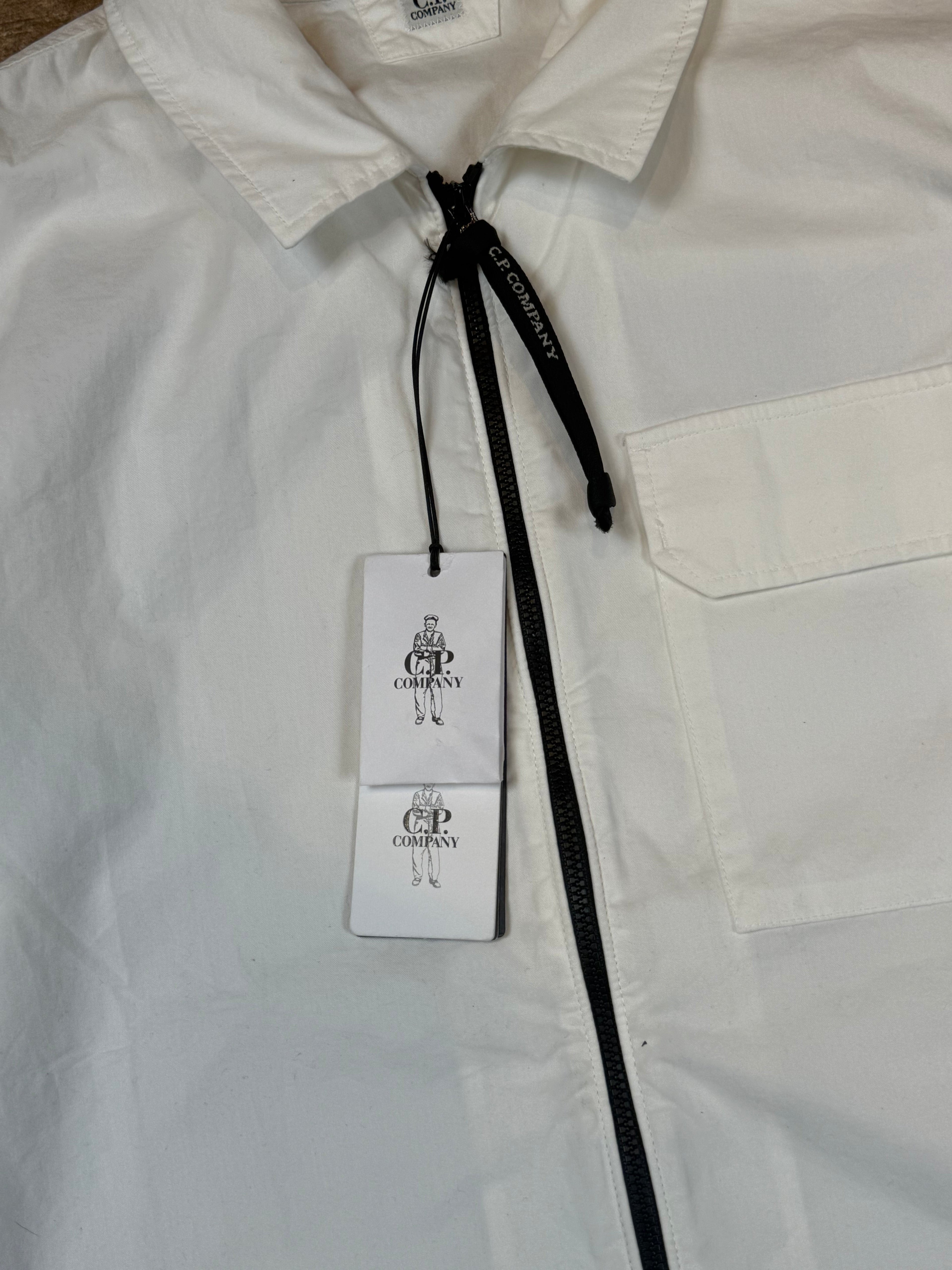 Archive No. 9 white C.P. Company lightweight zip-up overshirt with chest pocket and branded zip pull. Size L.