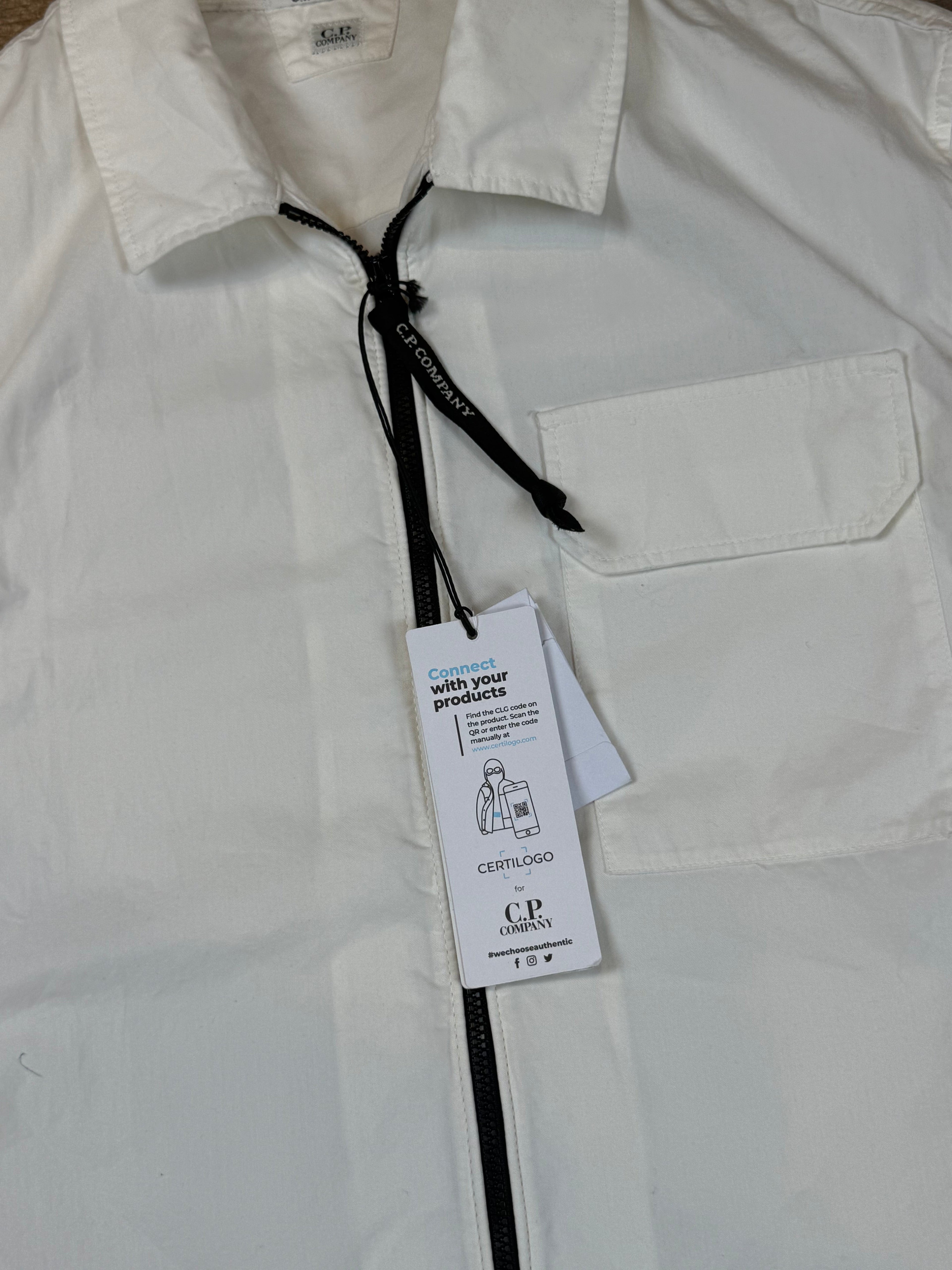 Archive No. 9 white C.P. Company lightweight zip-up overshirt with chest pocket and Certilogo tag.