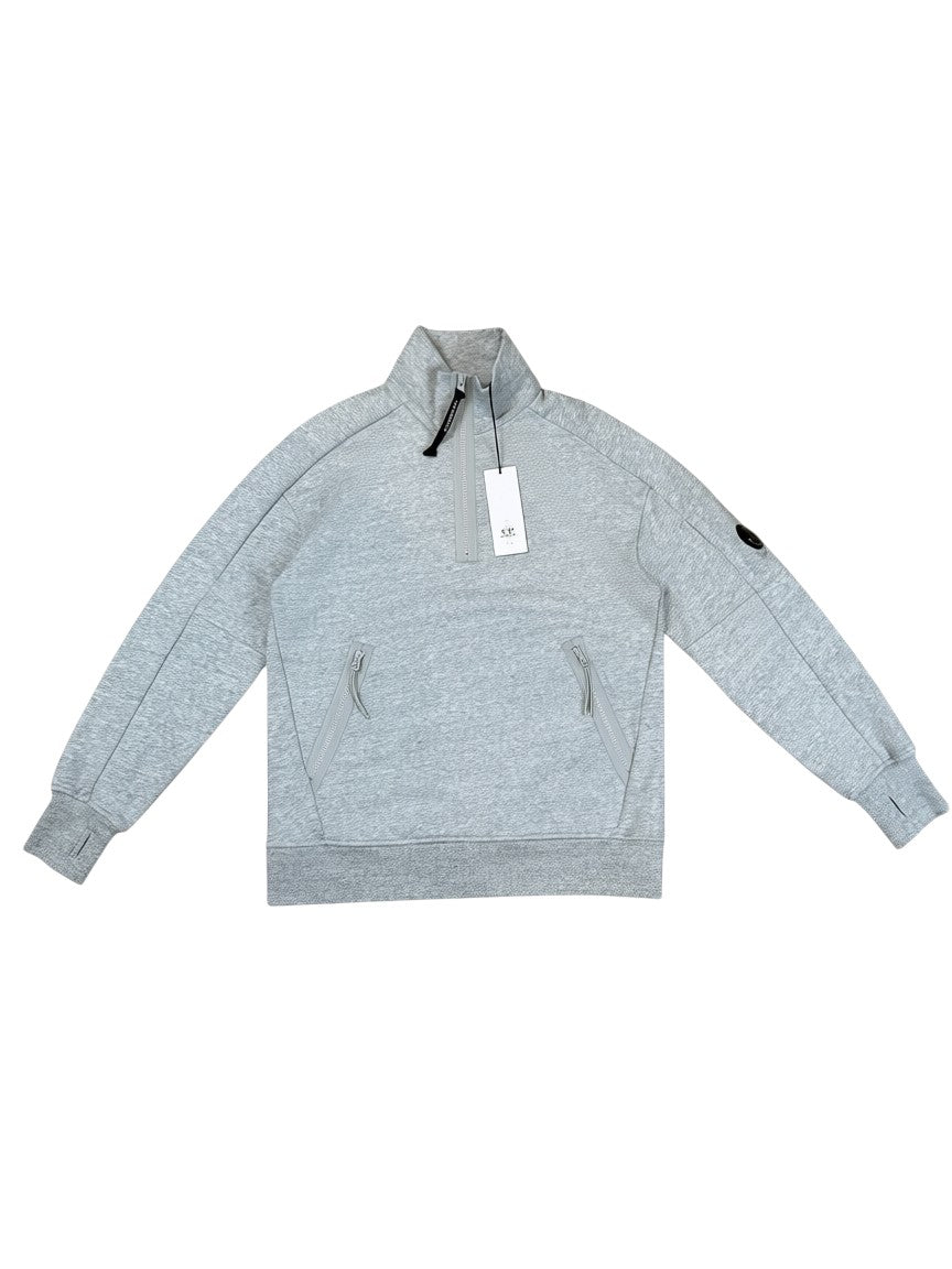 Archive No. 9 grey C.P. Company Quarter Zip jumper with lens detail on sleeve and zip pockets.