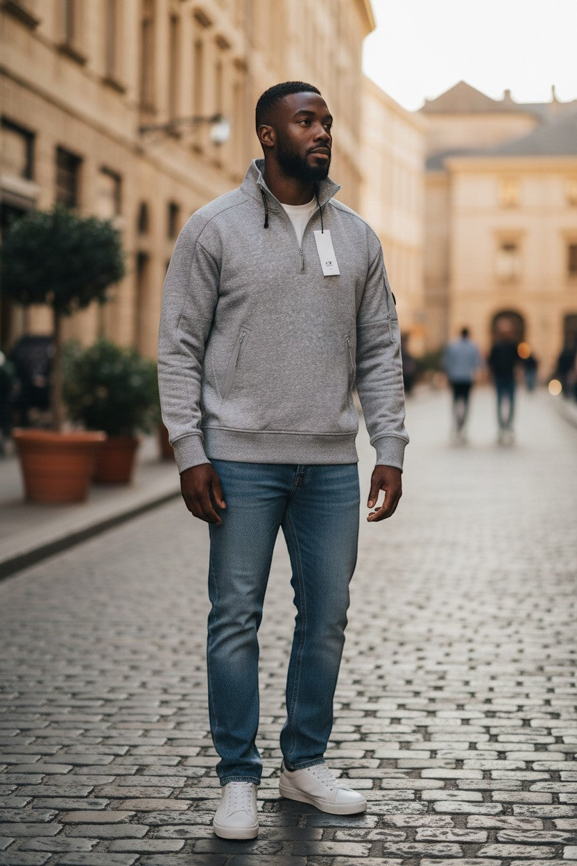 Archive No. 9 grey C.P. Company Quarter Zip jumper with lens detail on arm and zip pockets. Medium fit.