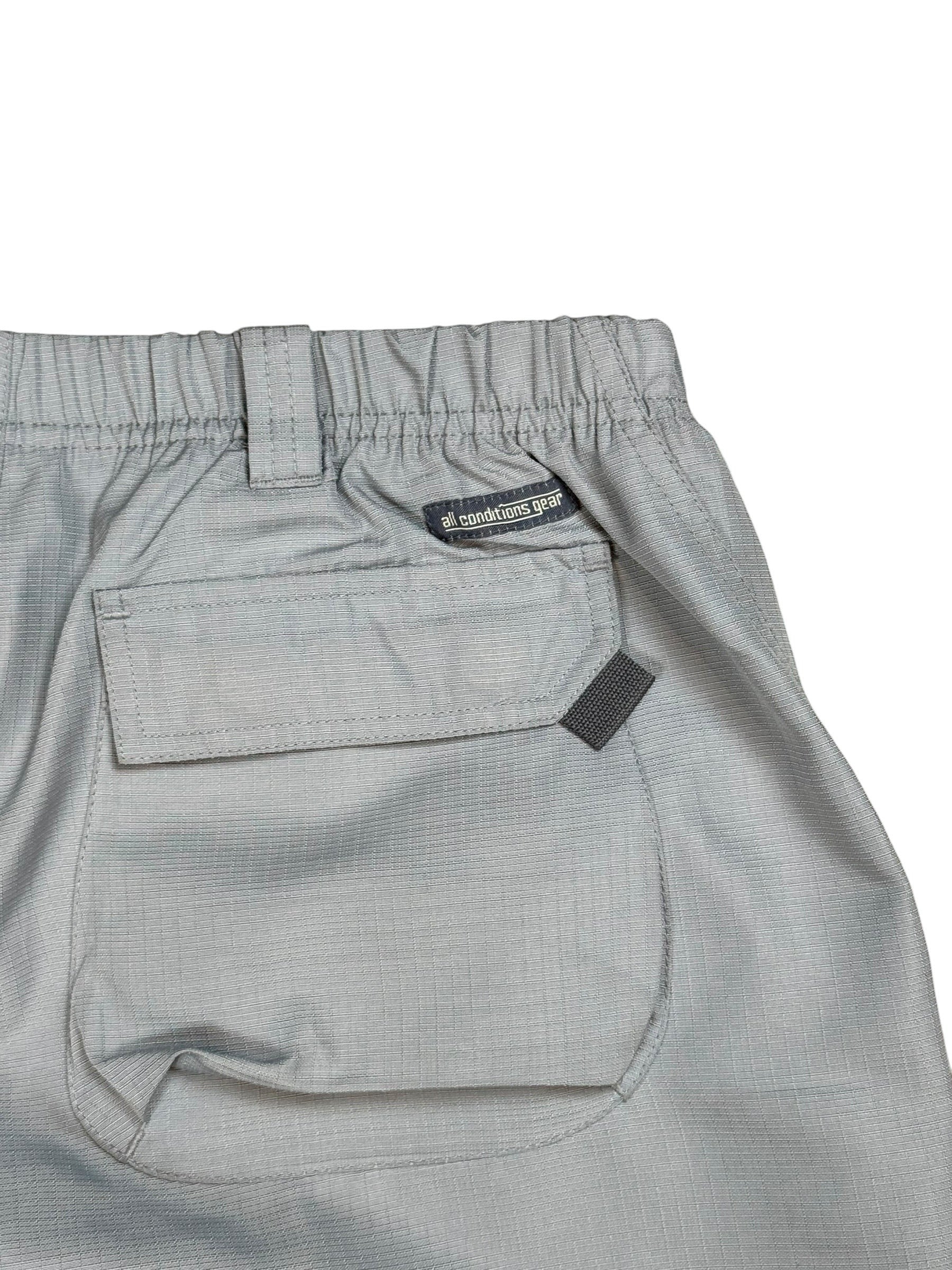 Archive No. 9 grey Nike ACG technical shorts with cargo pockets and elastic waistband. Waterproof and wind-resistant.