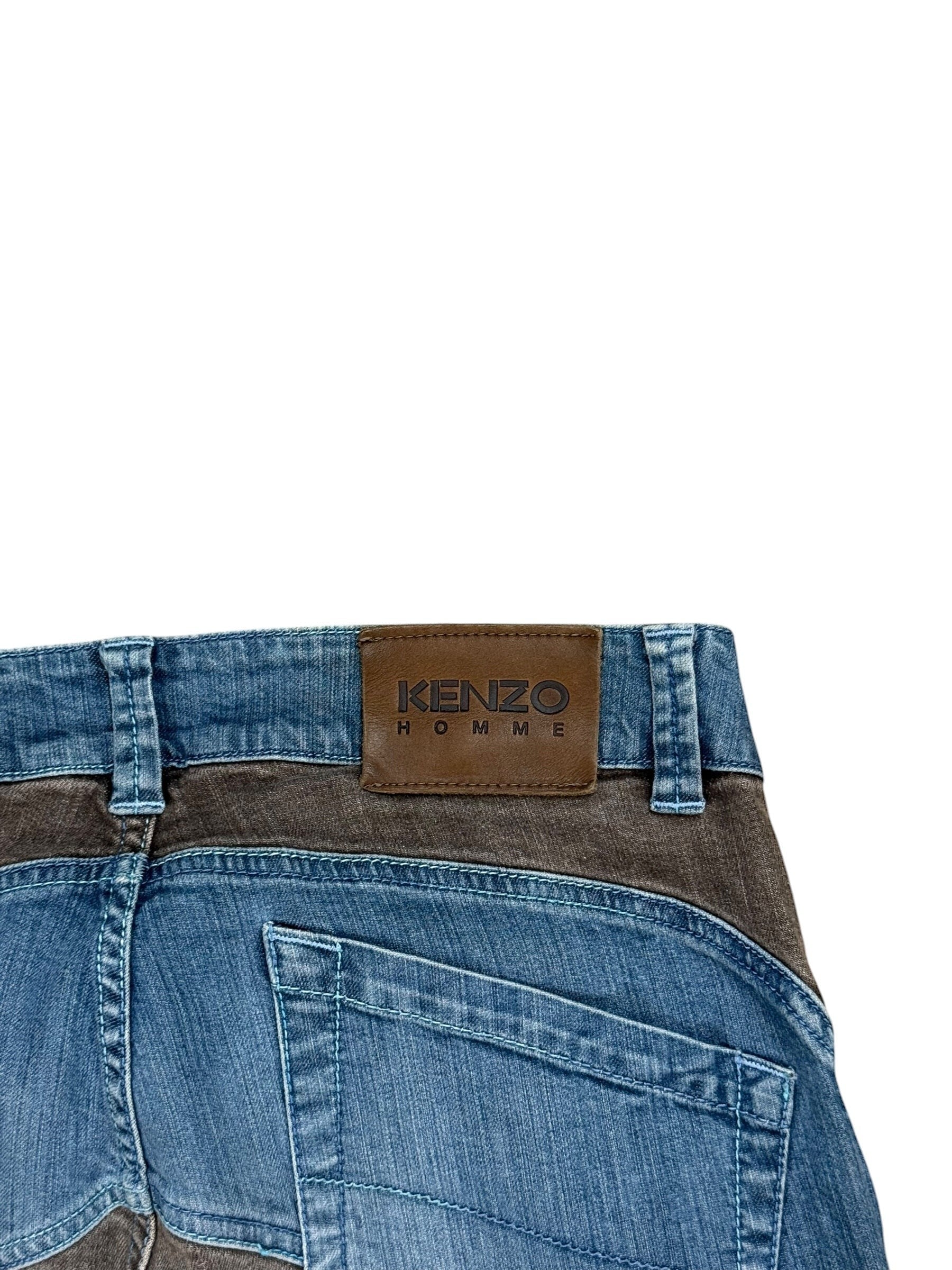 Archive No. 9 vintage Kenzo Homme jeans in blue denim with brown patchwork detail and leather logo patch. Size W30.