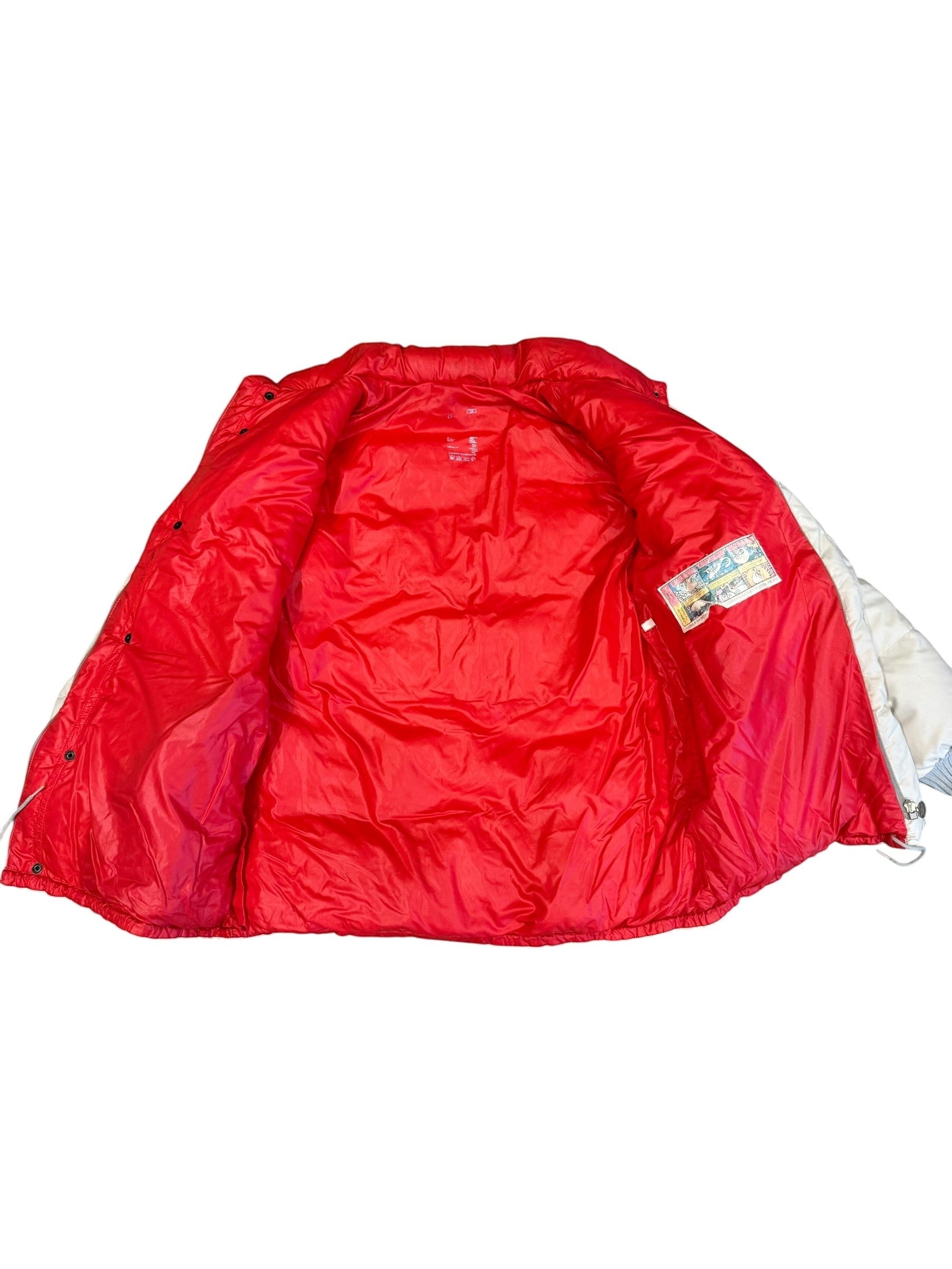 Archive No. 9 1990s Moncler beige down-filled puffer jacket with red lining and stowable hood. Size Large.