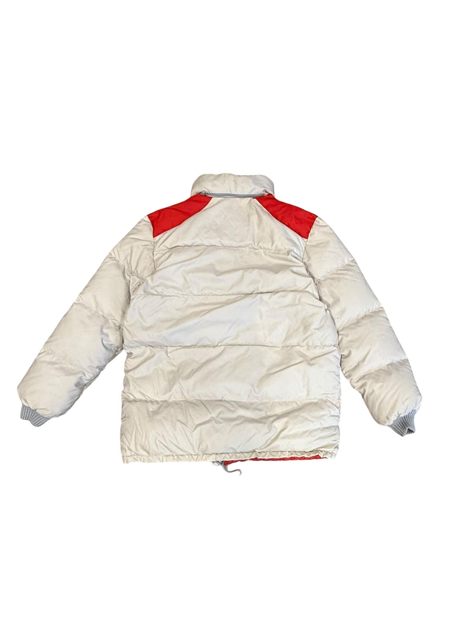 Archive No. 9 1990s beige Moncler down puffer jacket with red shoulder accents and a packable hood.