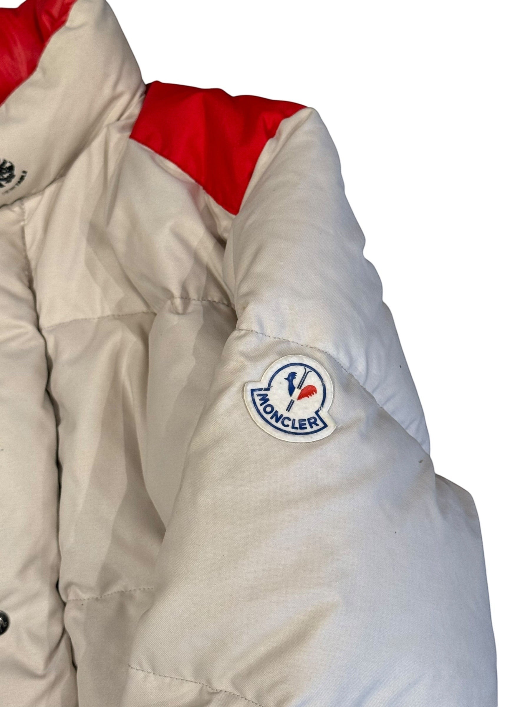 Archive No. 9 1990s Moncler beige puffer jacket with red accents on shoulders, down-filled, and a stowable hood. Size Large.