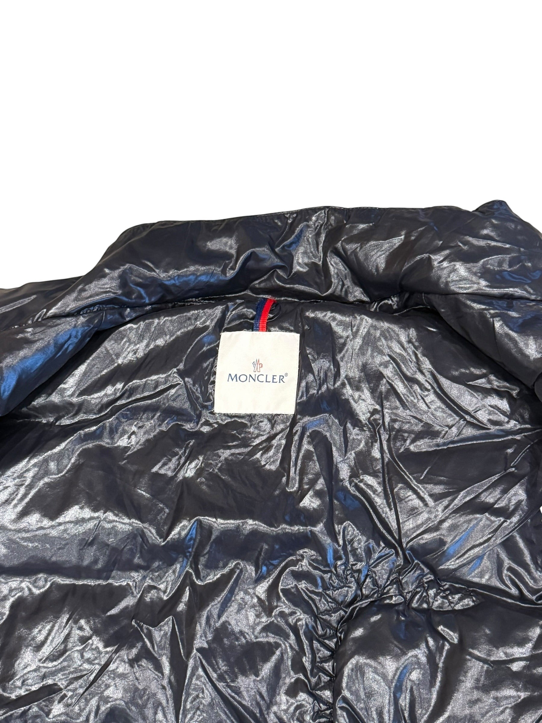 Archive No. 9 Moncler black down-filled gilet, size XL. Features signature Moncler logo tag.