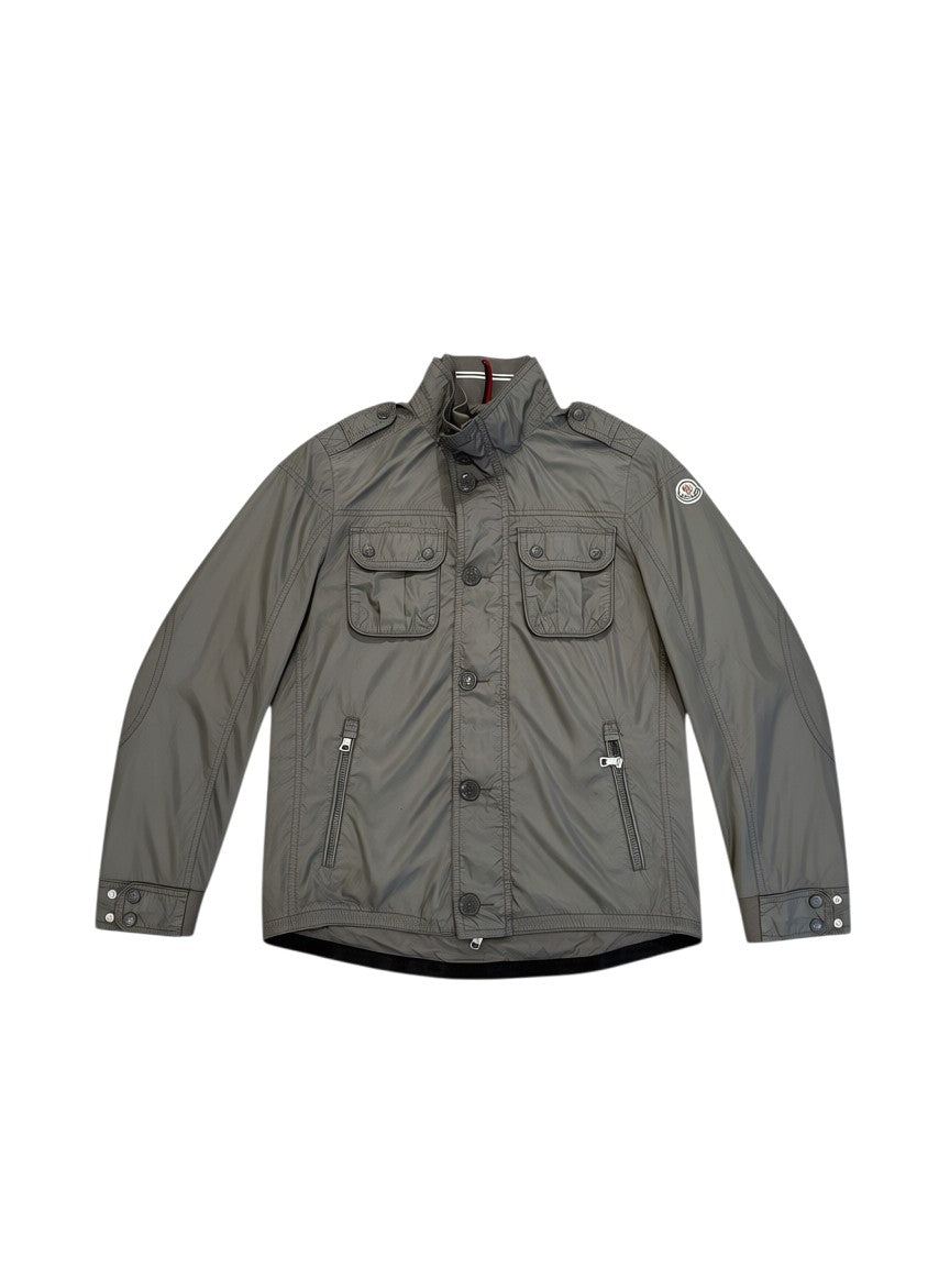 Archive No. 9 grey Moncler utility jacket, lightweight, waterproof, size L with multiple pockets and button closure.