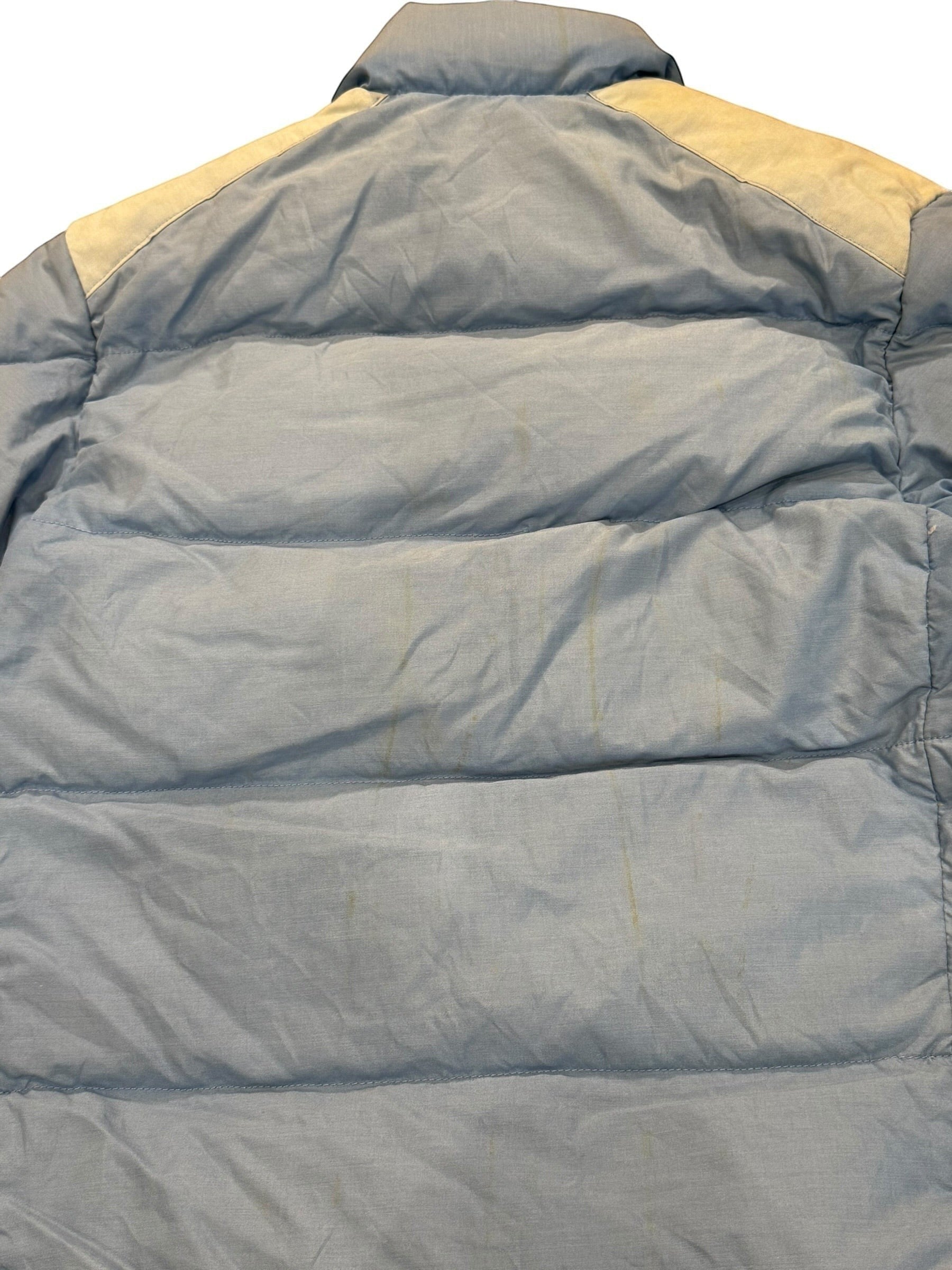 Archive No. 9 vintage 1990s Moncler light blue down puffer jacket, size Large. Features down filling and a streamlined silhouette.