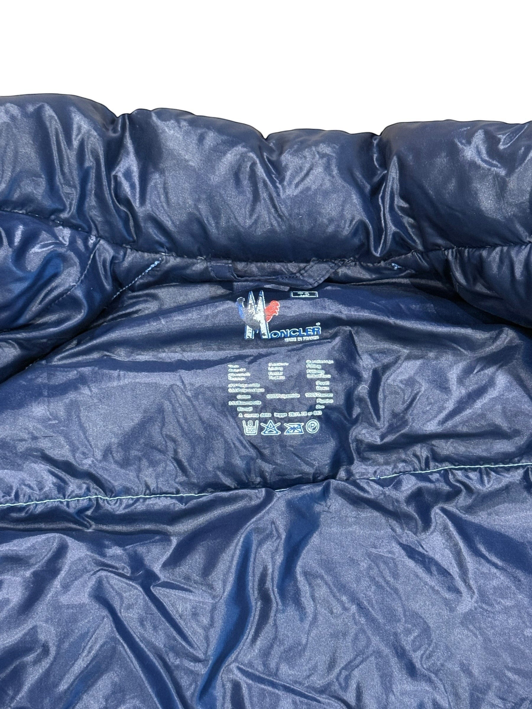 Archive No. 9 Moncler vintage blue down puffer jacket, size Large. Features down filling for warmth and a streamlined silhouette.