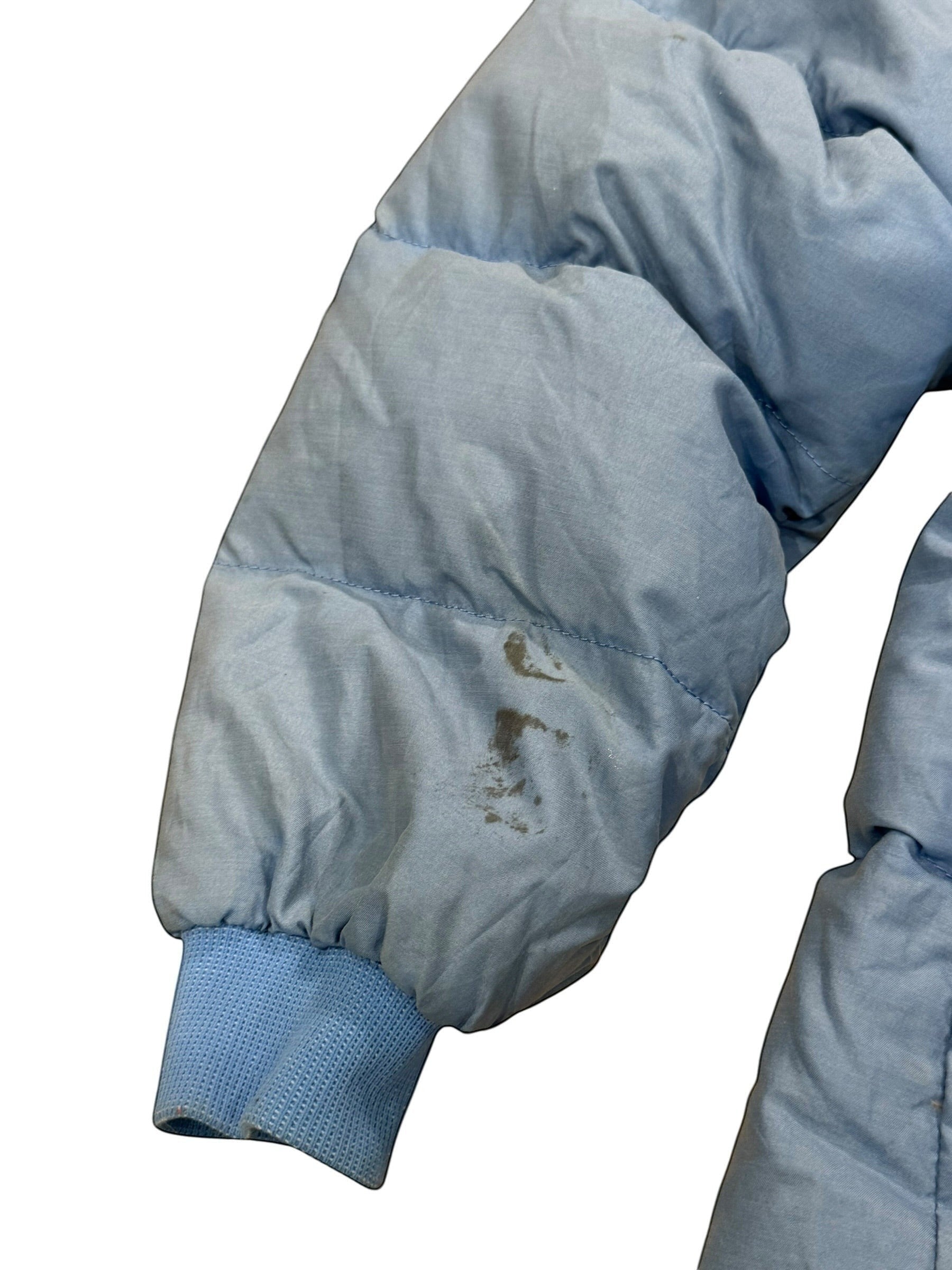 Archive No. 9 vintage light blue Moncler down puffer jacket, size Large. Features down filling and a streamlined silhouette. Note: marks on back and sleeve.