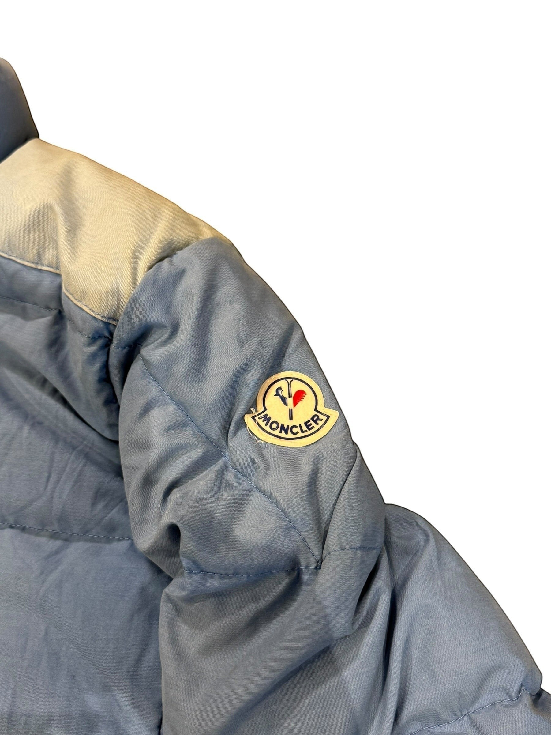 Archive No. 9 vintage 1990s Moncler light blue down puffer jacket, size Large. Features iconic logo patch.