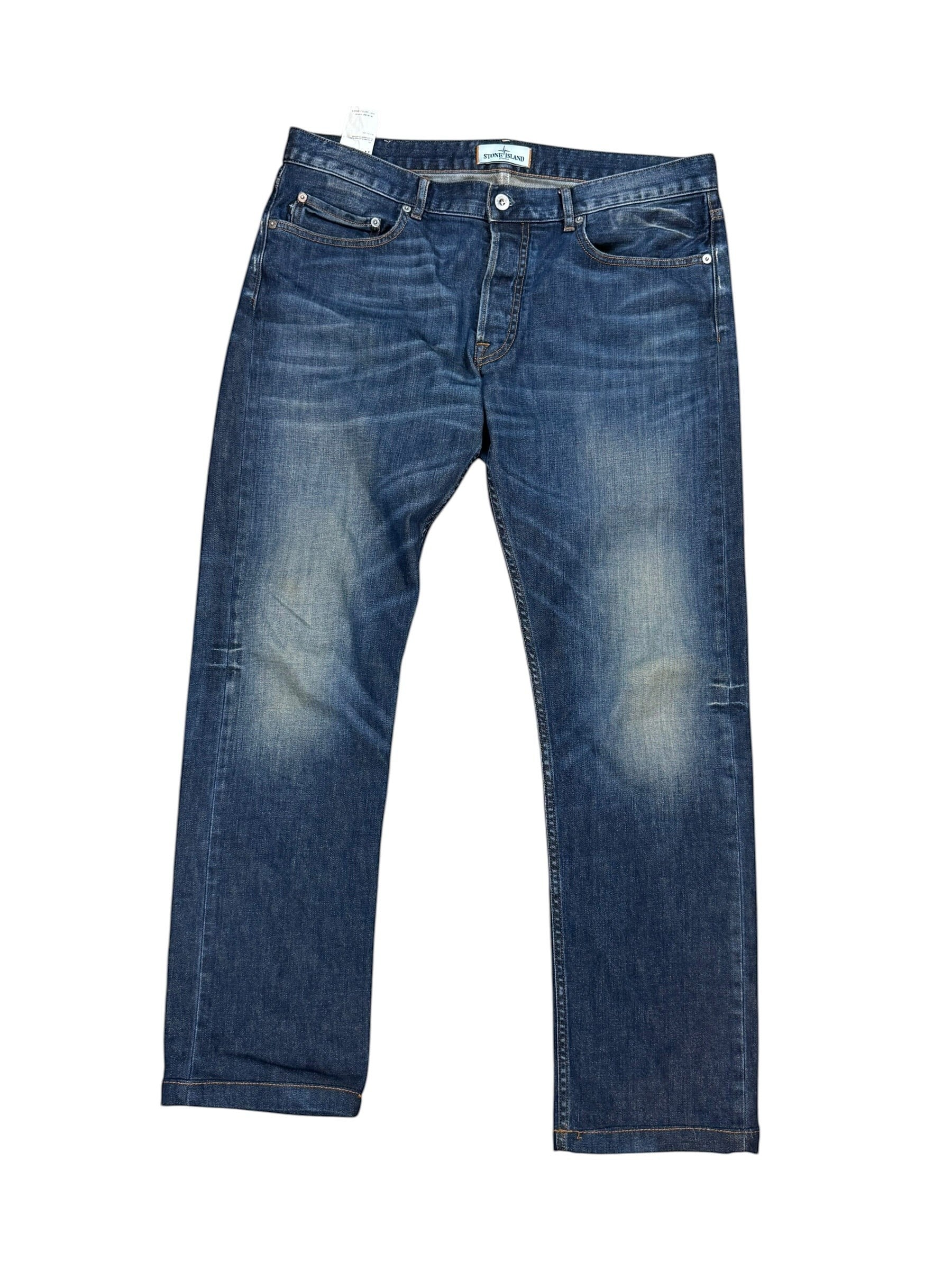 Archive No. 9 vintage navy blue denim jeans for men, size W34, featuring a relaxed straight cut and iconic Stone Island compass badge detail.