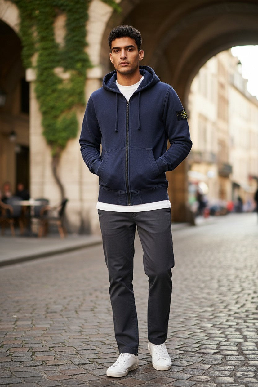 Archive No. 9 navy blue Stone Island Junior zip-up hoodie with compass badge on arm, size 12.