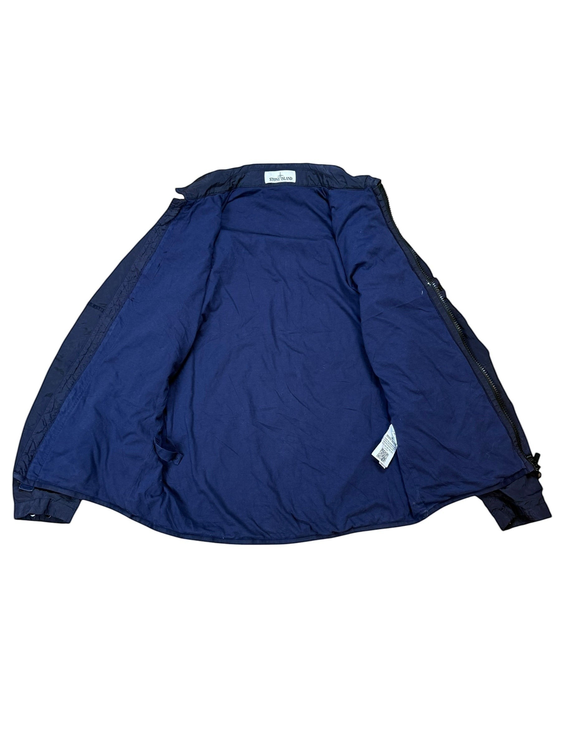 Archive No. 9 navy Stone Island nylon metal jacket, size M, lightweight technical design, 100% nylon. Small rip on back of arm.