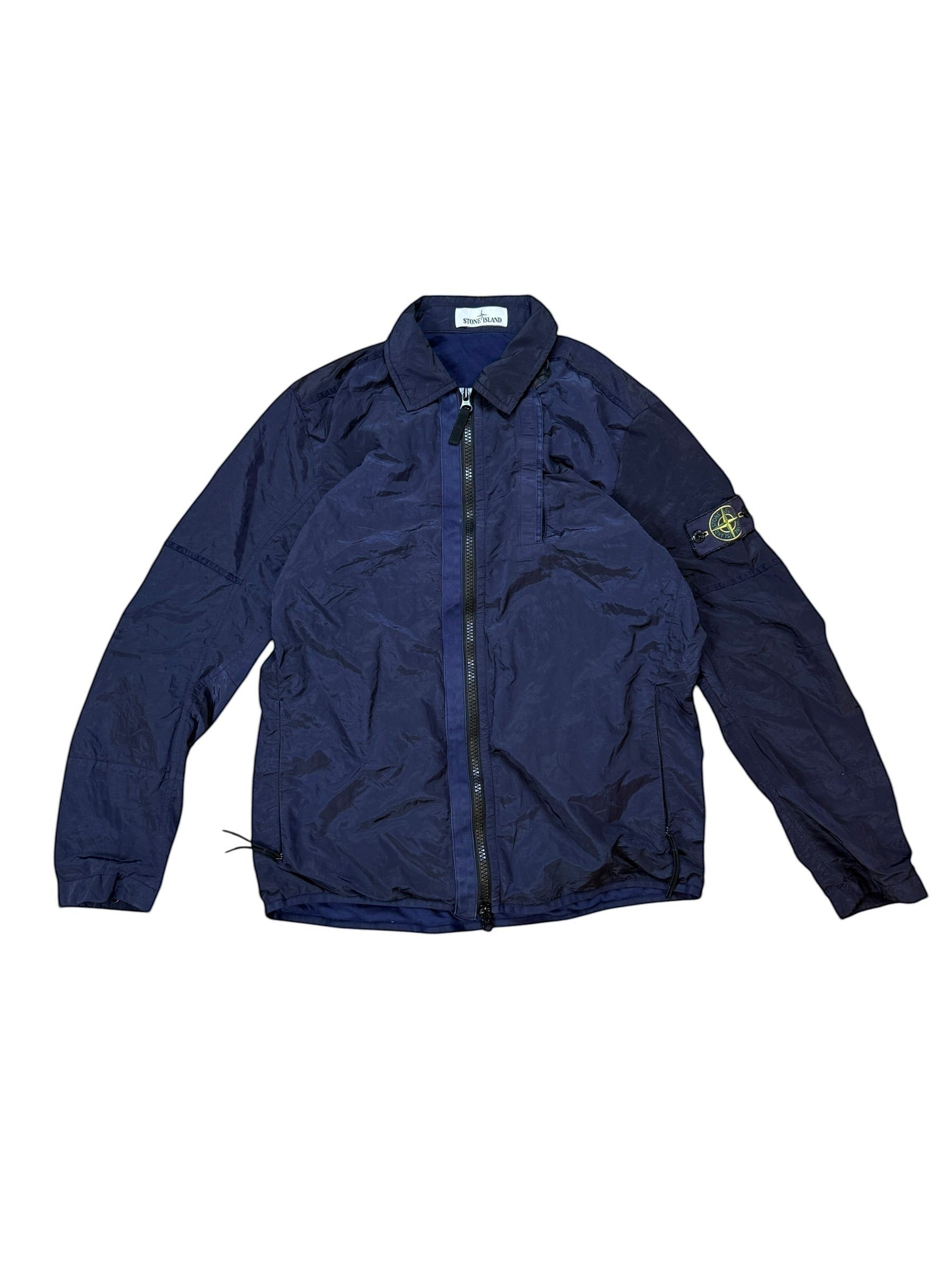 Archive No. 9 navy Stone Island nylon metal jacket, size M, lightweight technical design with zip closure and compass badge on sleeve.