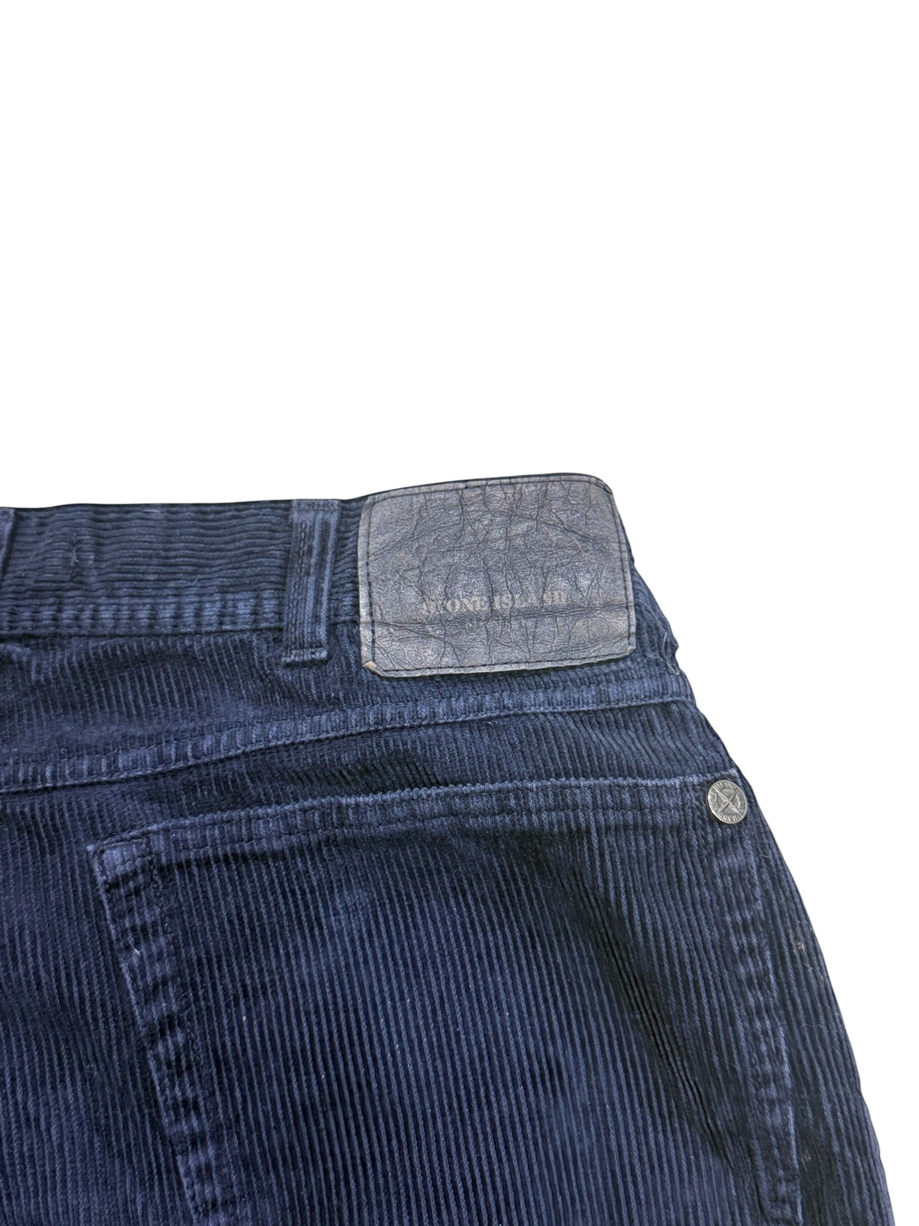 Archive No. 9 navy velvet corduroy trousers with a vintage Stone Island Marina leather patch.