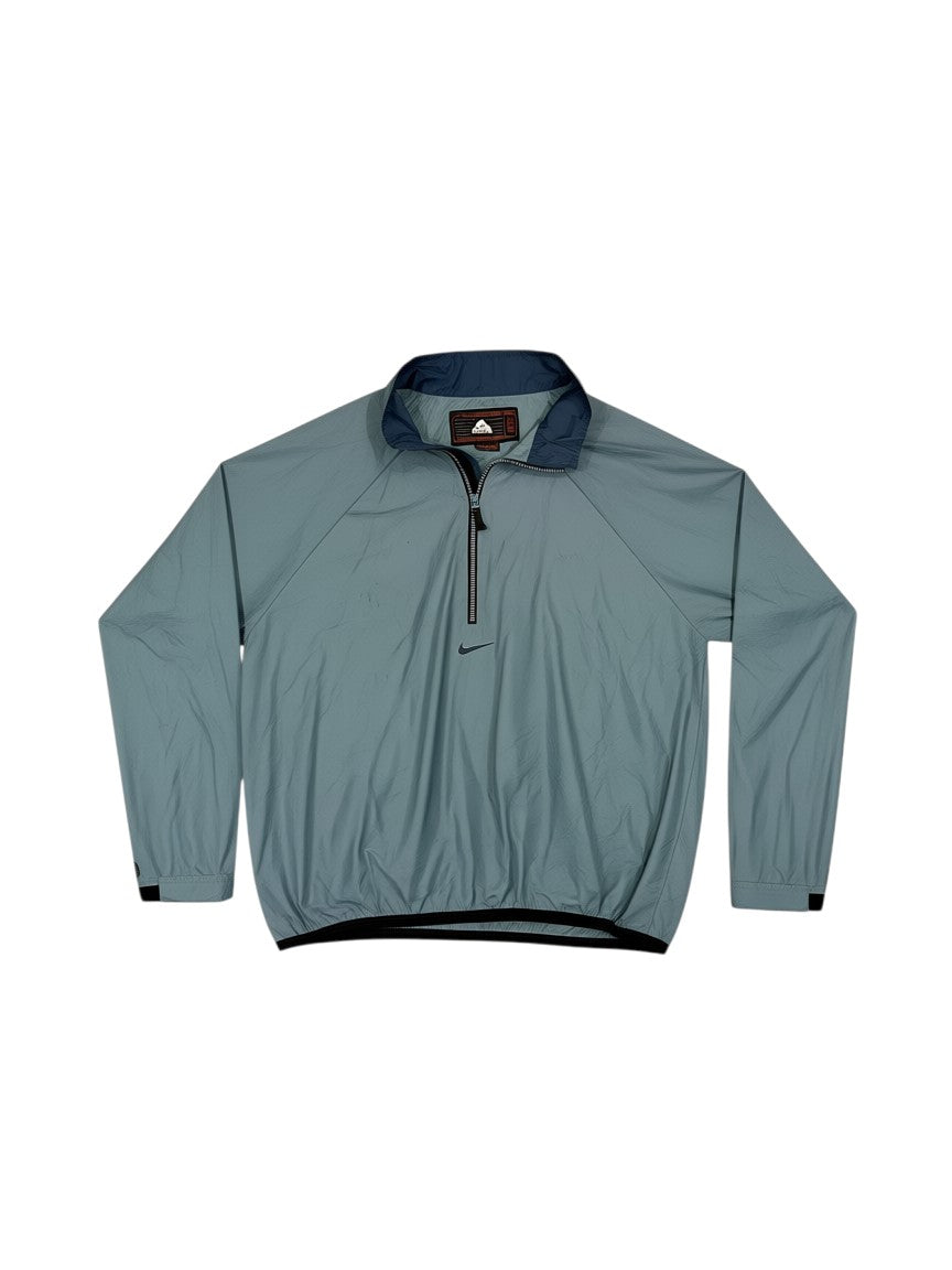 Archive No. 9 Nike ACG blue lightweight half-zip windbreaker jacket, size XL. Features breathable fabric and relaxed fit.