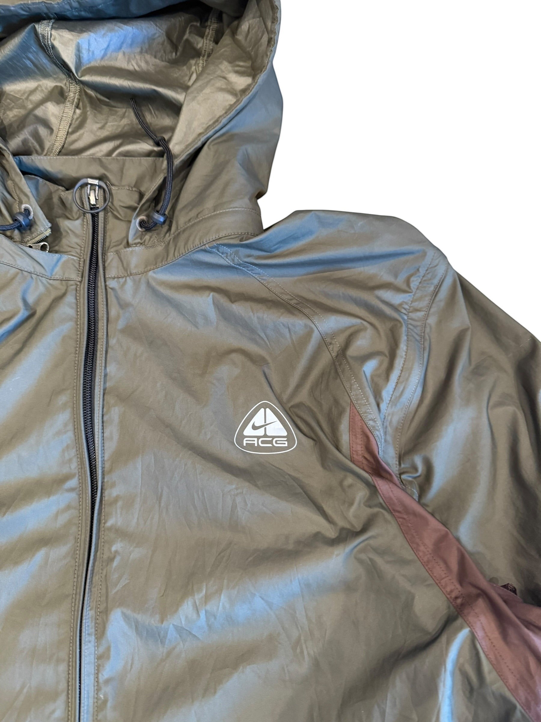 Archive No. 9 Nike ACG burgundy and khaki windbreaker jacket, size L. Lightweight, water and wind resistant with ACG logo.