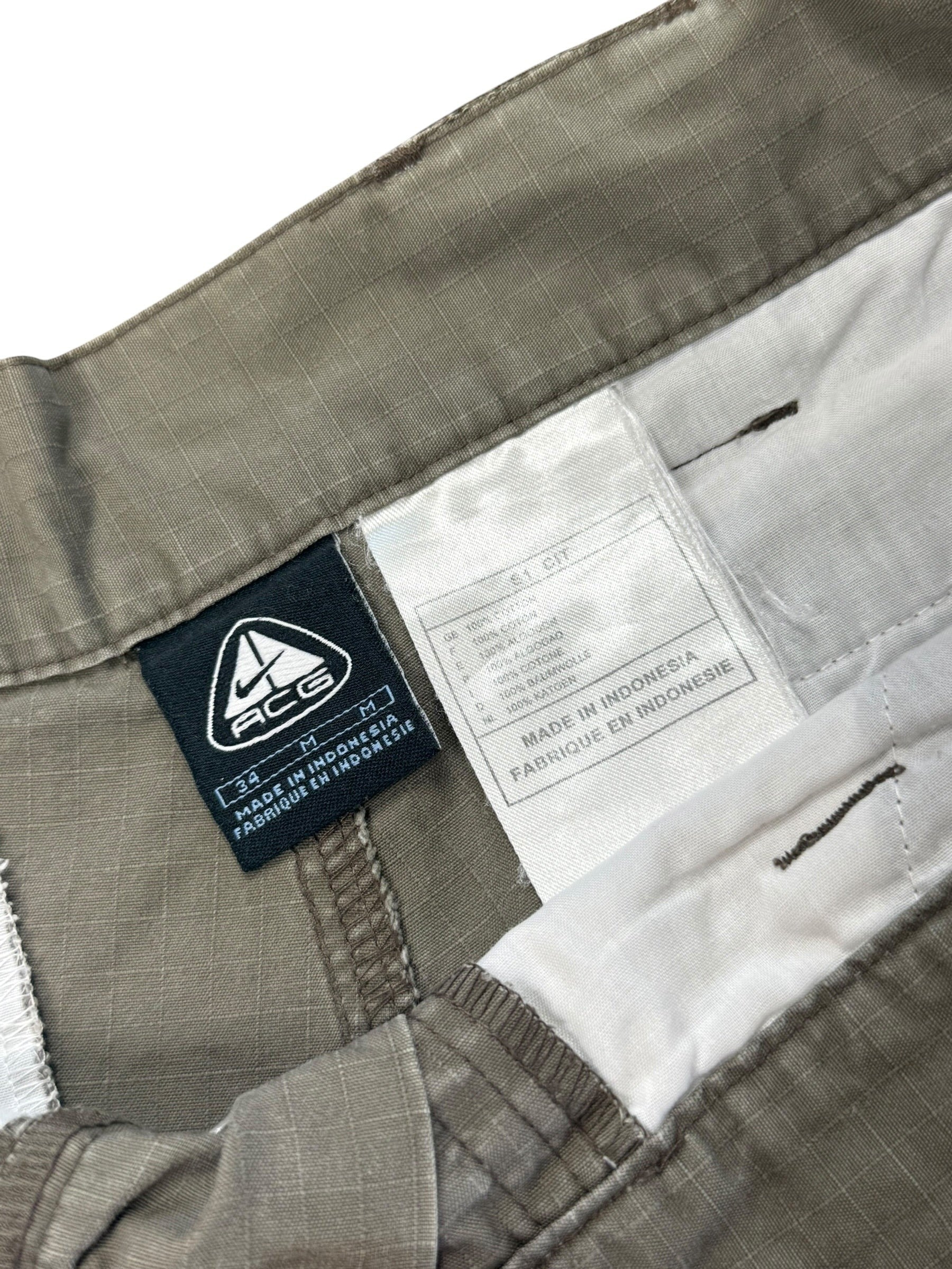 Archive No.9 Nike ACG grey technical shorts, size W34, made from waterproof material with multiple pockets.