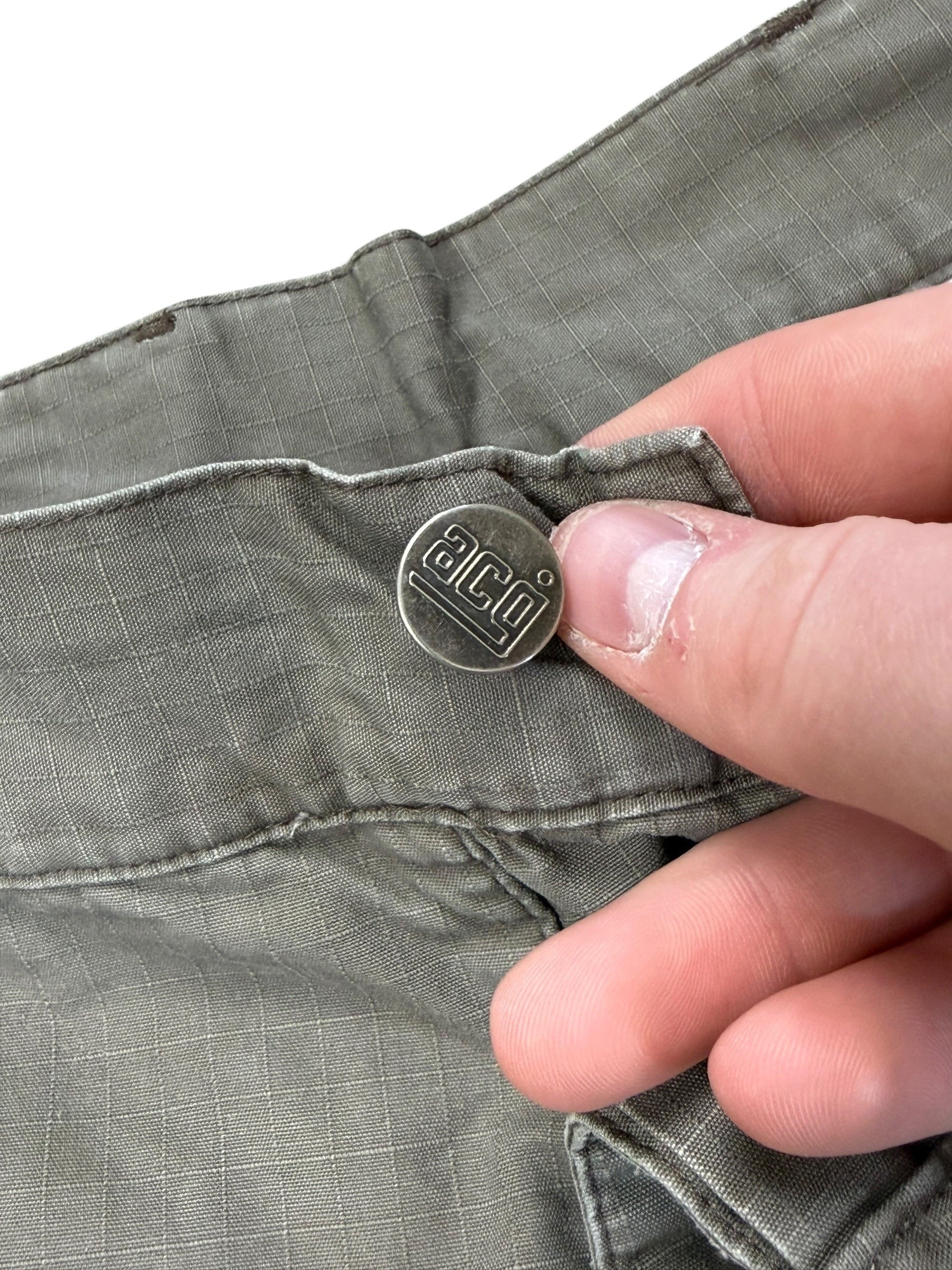 Archive No.9 Nike ACG grey technical shorts with waterproof material and multi-pocket design. Size W34.