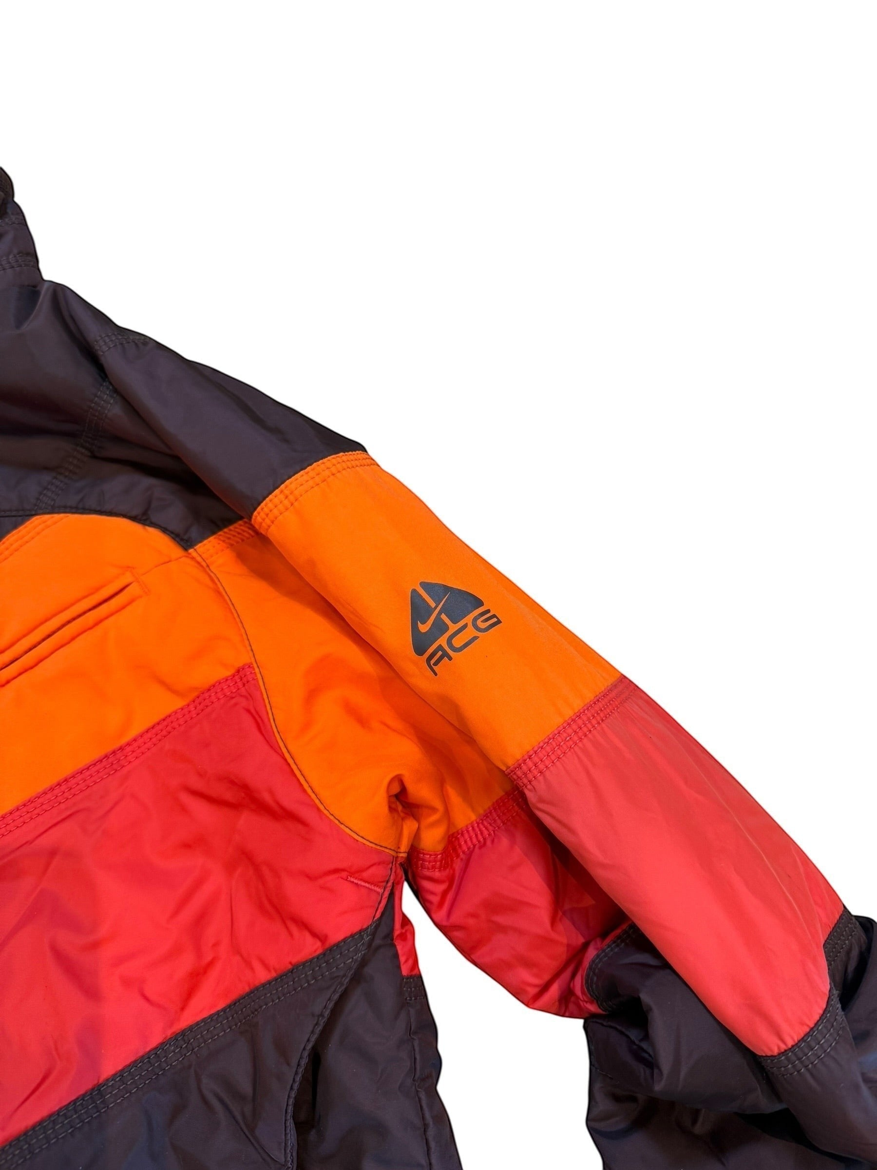 Archive No. 9 Nike ACG orange, red, and black down puffer jacket with ACG logo on sleeve. Size Small.