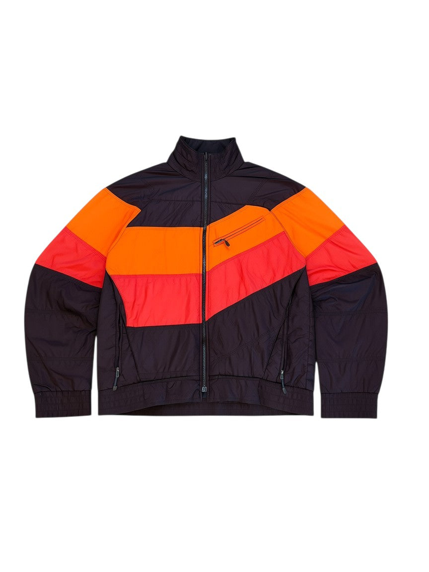 Archive No.9 Nike ACG orange, red, and black down puffer jacket with zip pockets and a stand-up collar.