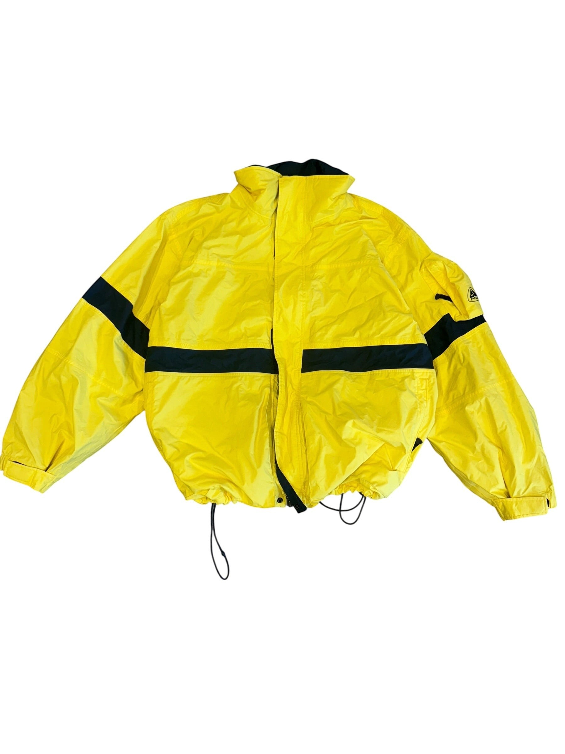 Archive No. 9 yellow Nike ACG ski jacket, size Large, with black stripe details and adjustable hem.