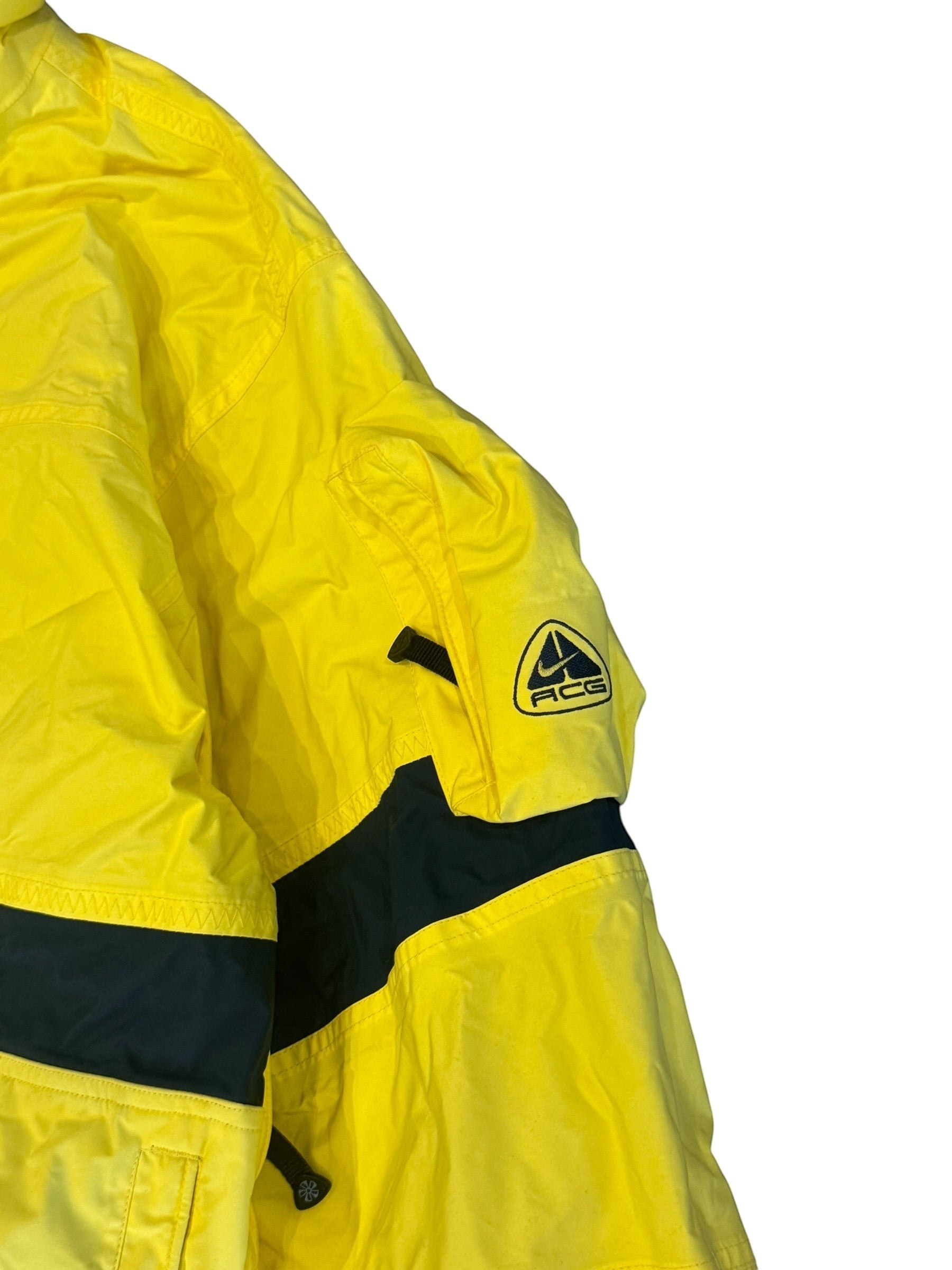Archive No. 9 Nike ACG yellow ski jacket, size Large. Durable, warm, and water-resistant for cold weather adventures.