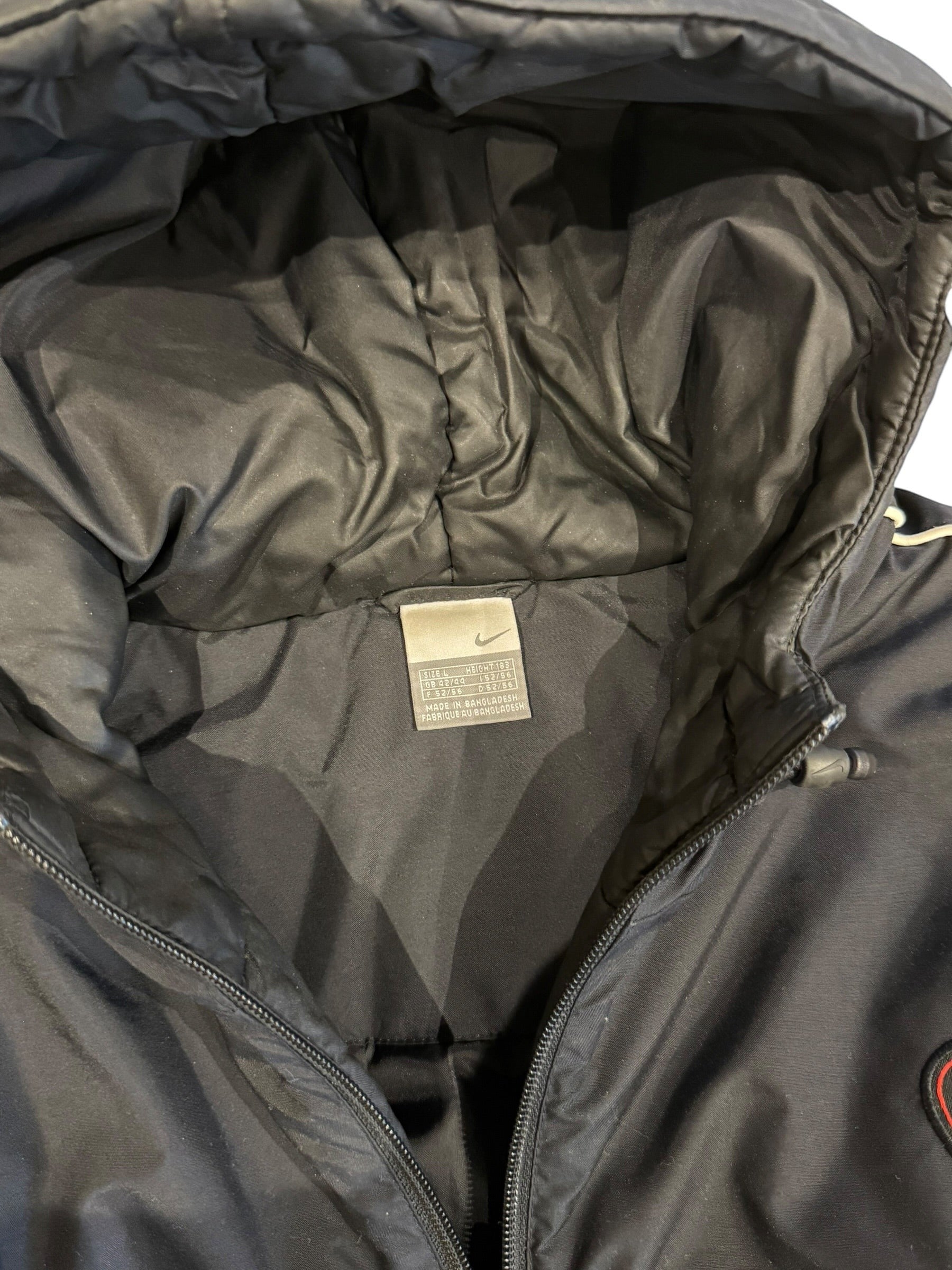 Archive No. 9 Nike black down puffer jacket, size Large, with hood and full zip closure. Ideal for cold weather layering.