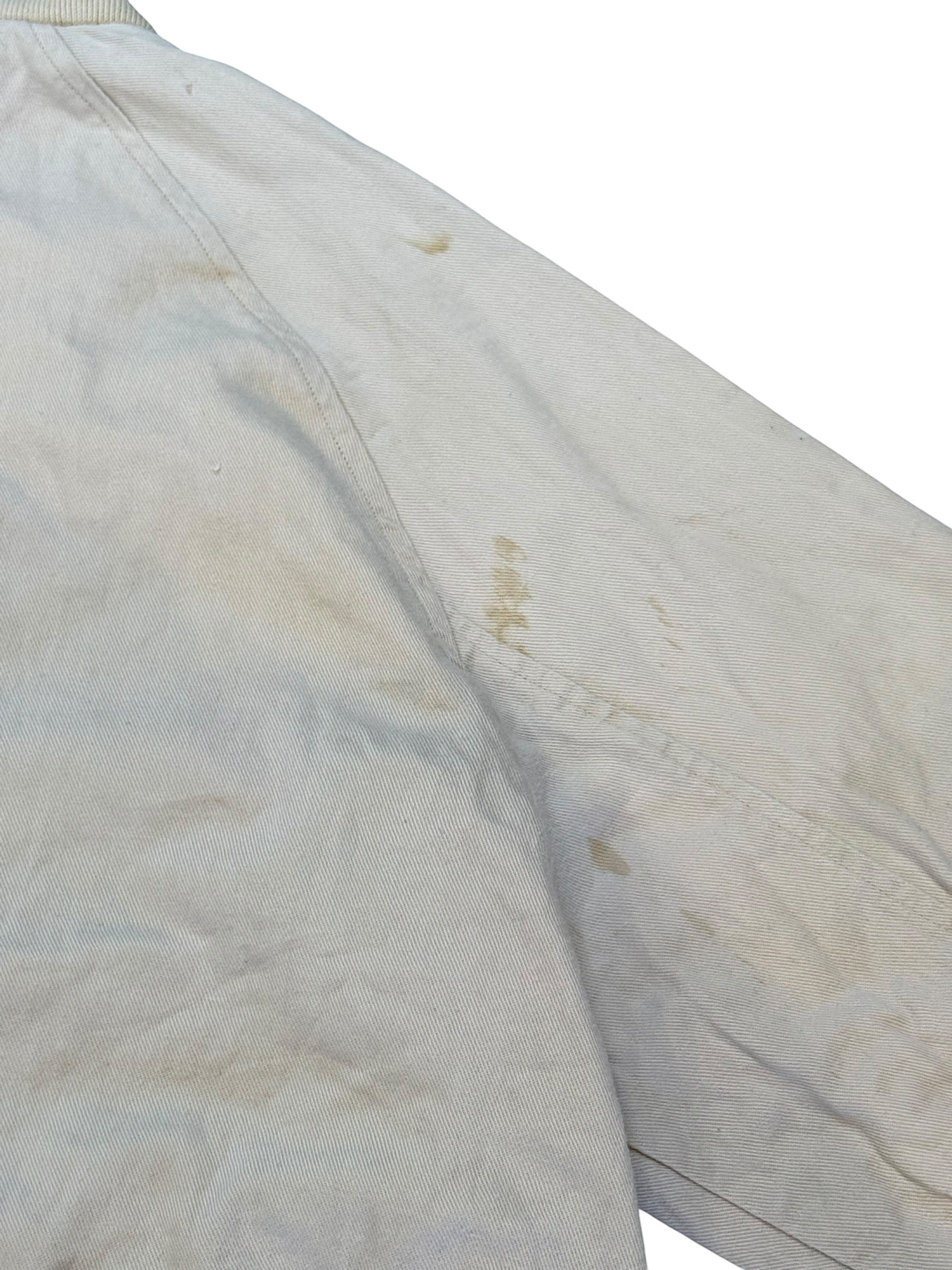 Archive No. 9 Nike cream bomber jacket, size Large, with visible marks and stains. Casual outerwear.