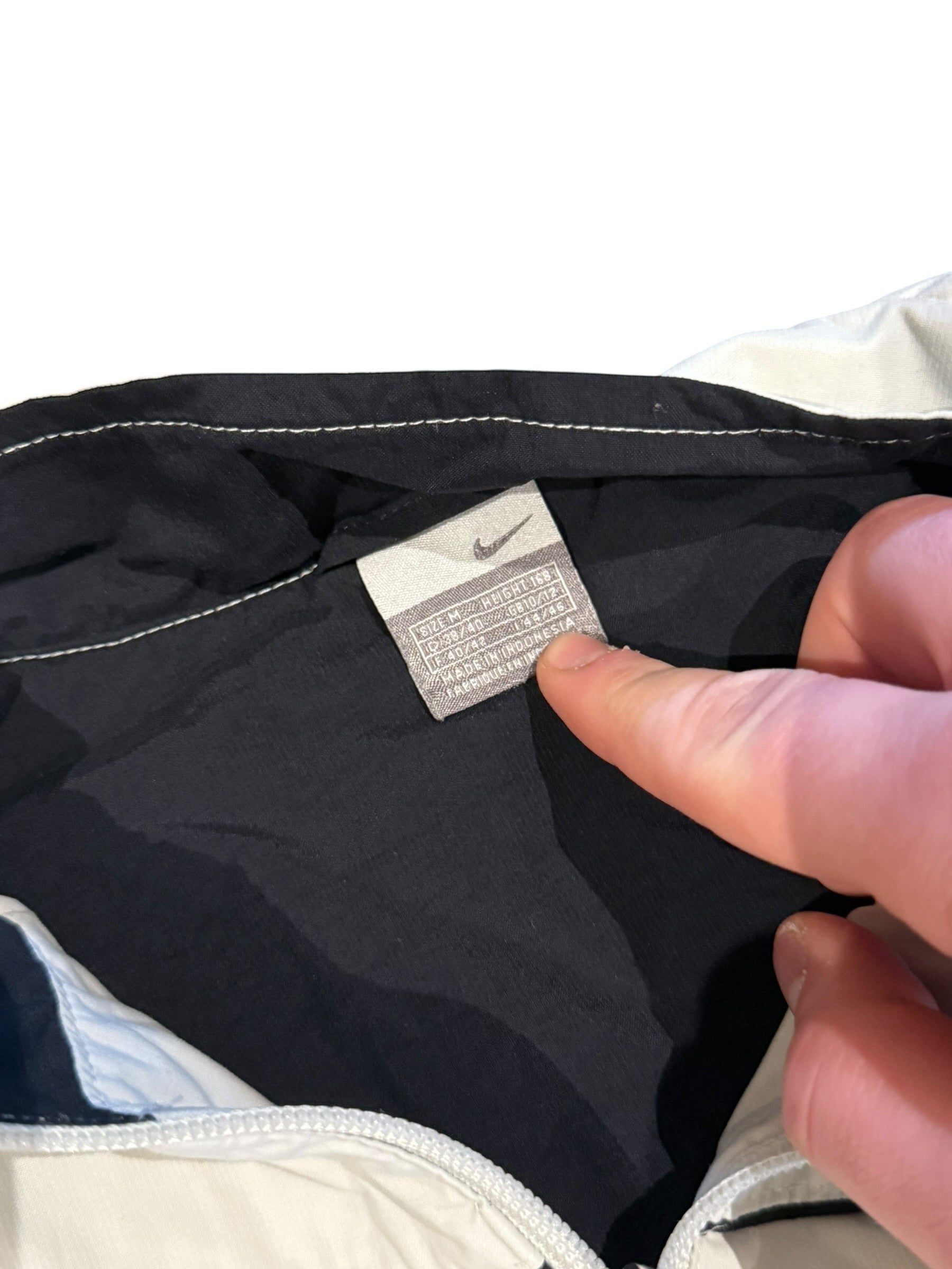 Archive No. 9 vintage Nike grey and white windbreaker jacket, size Medium. Lightweight and wind-resistant.