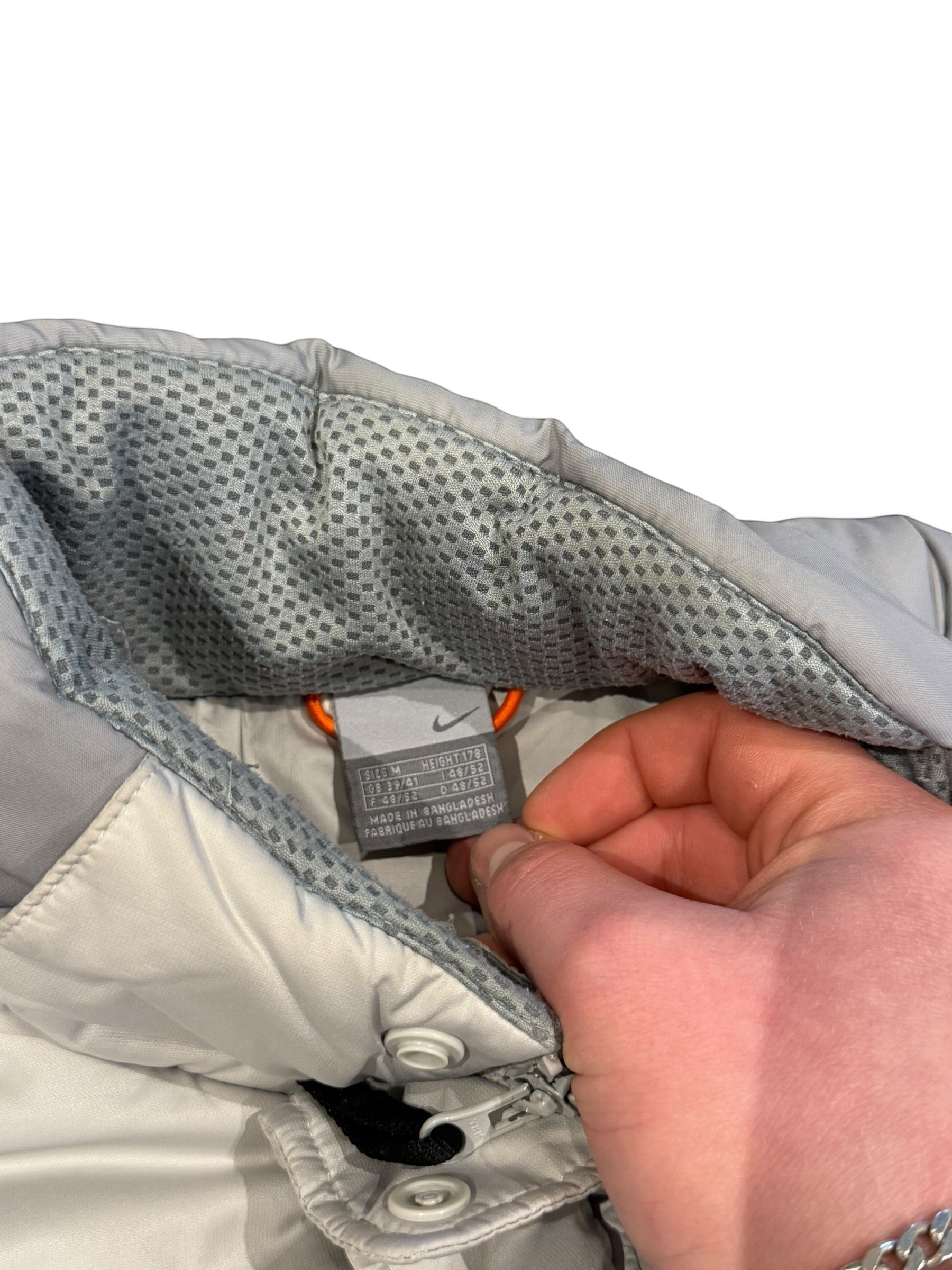Archive No. 9 Nike light grey down puffer jacket, size Medium, wind-resistant and warm.