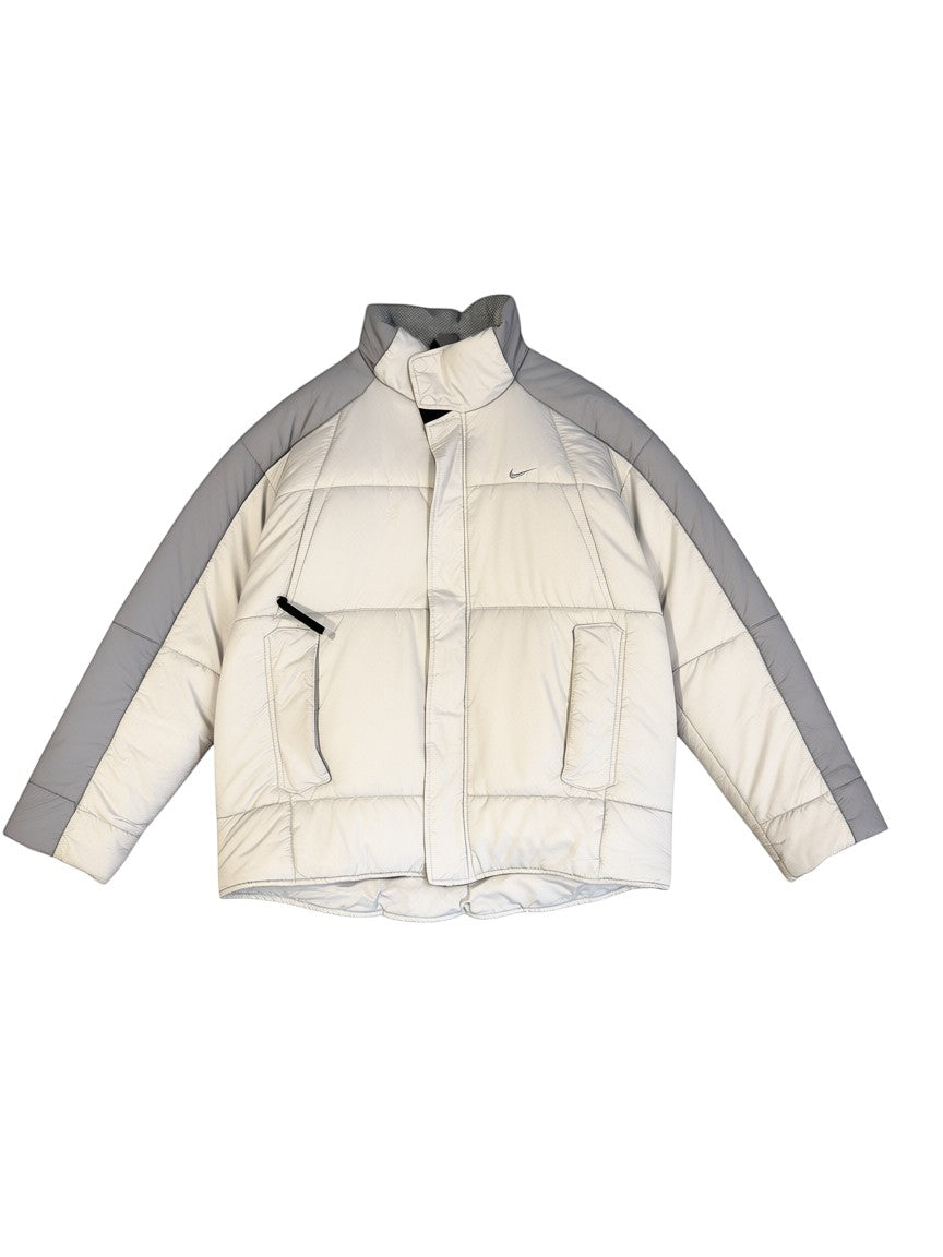 Archive No. 9 Nike light grey and white down puffer jacket, size Medium. Wind-resistant and warm.