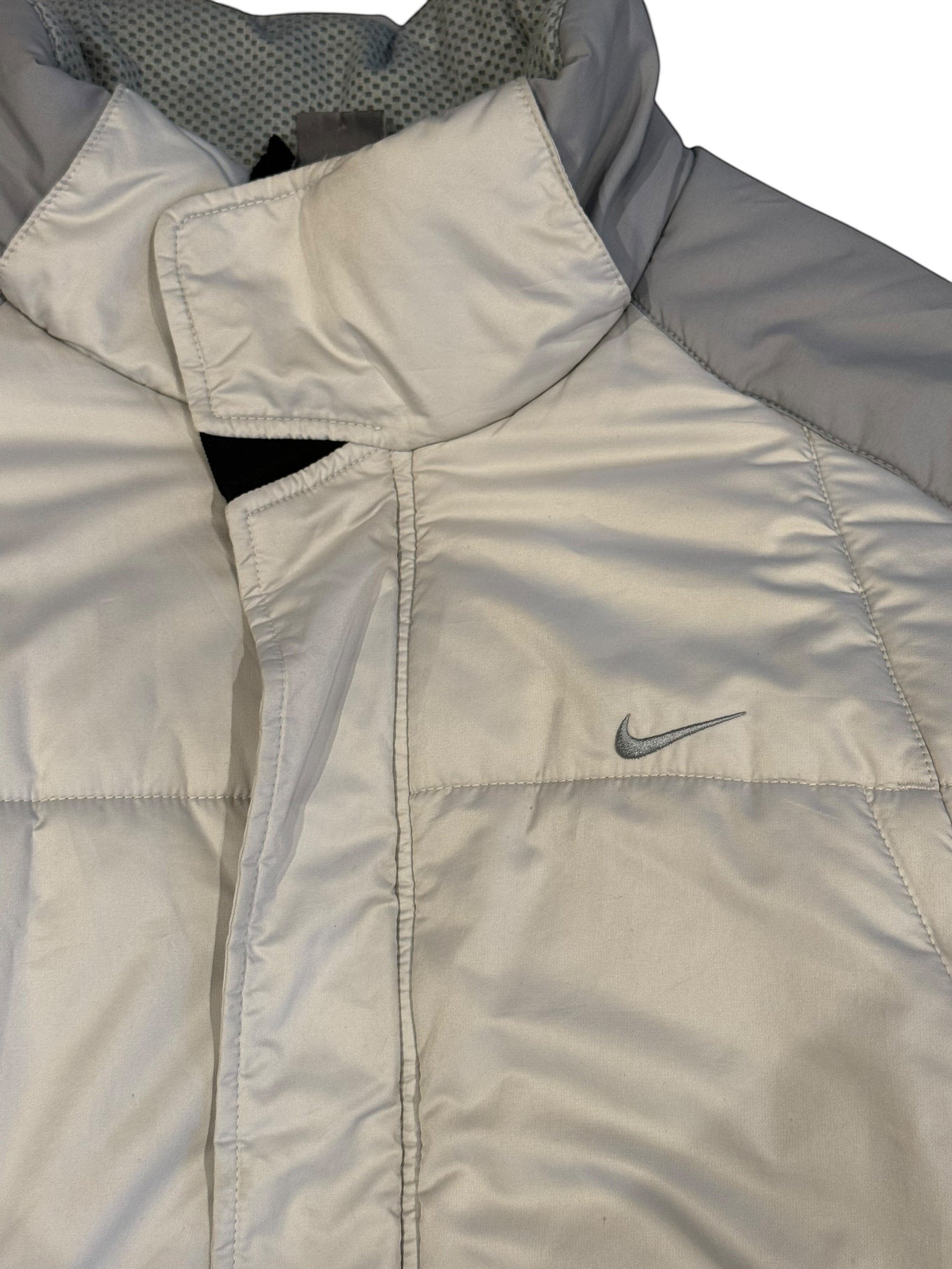Archive No. 9 Nike light grey and white down puffer jacket, size Medium. Wind-resistant and warm.