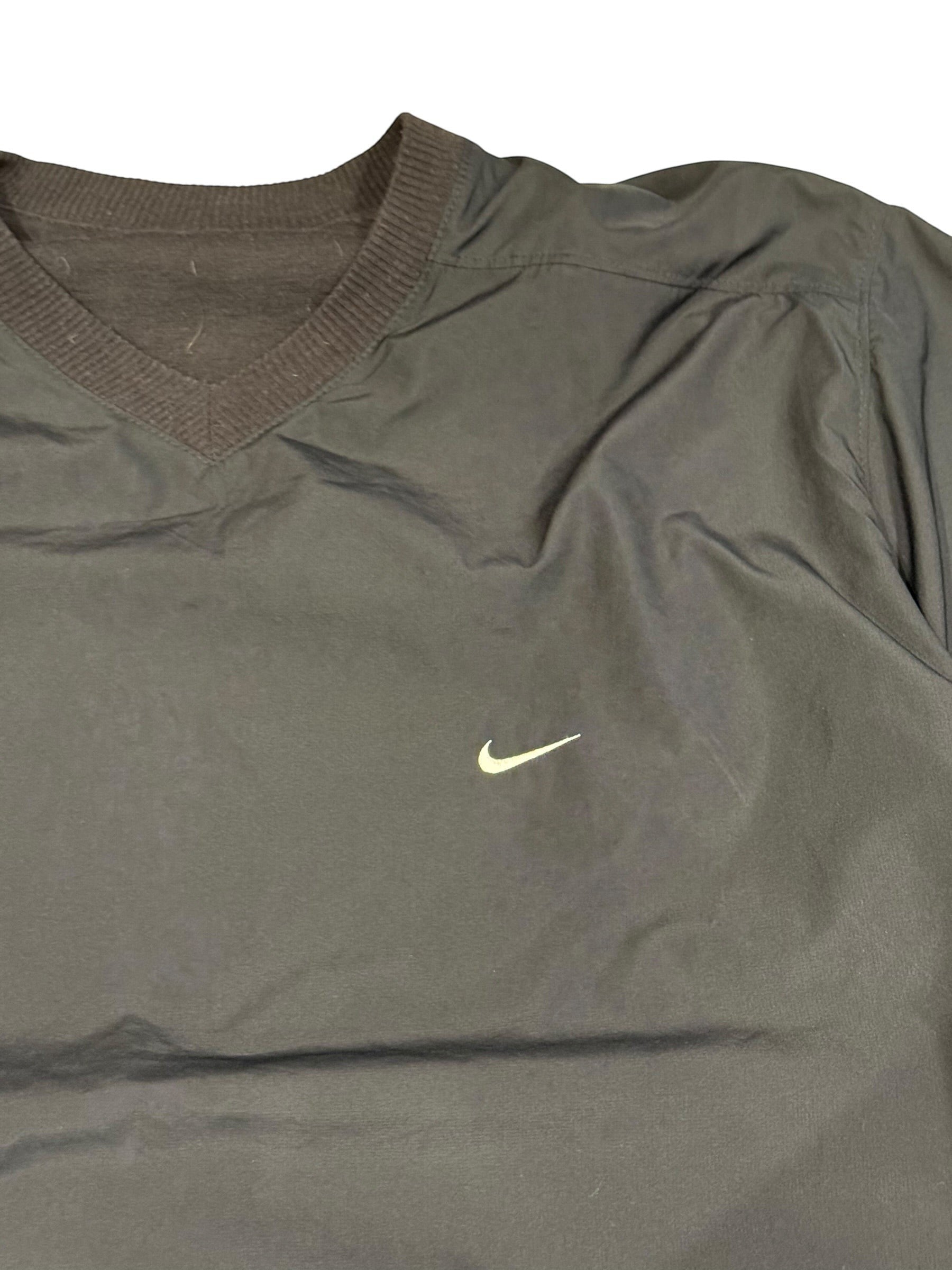 Archive No. 9 Nike navy training jacket with V-neck and white swoosh logo. Wind-resistant, size Large.