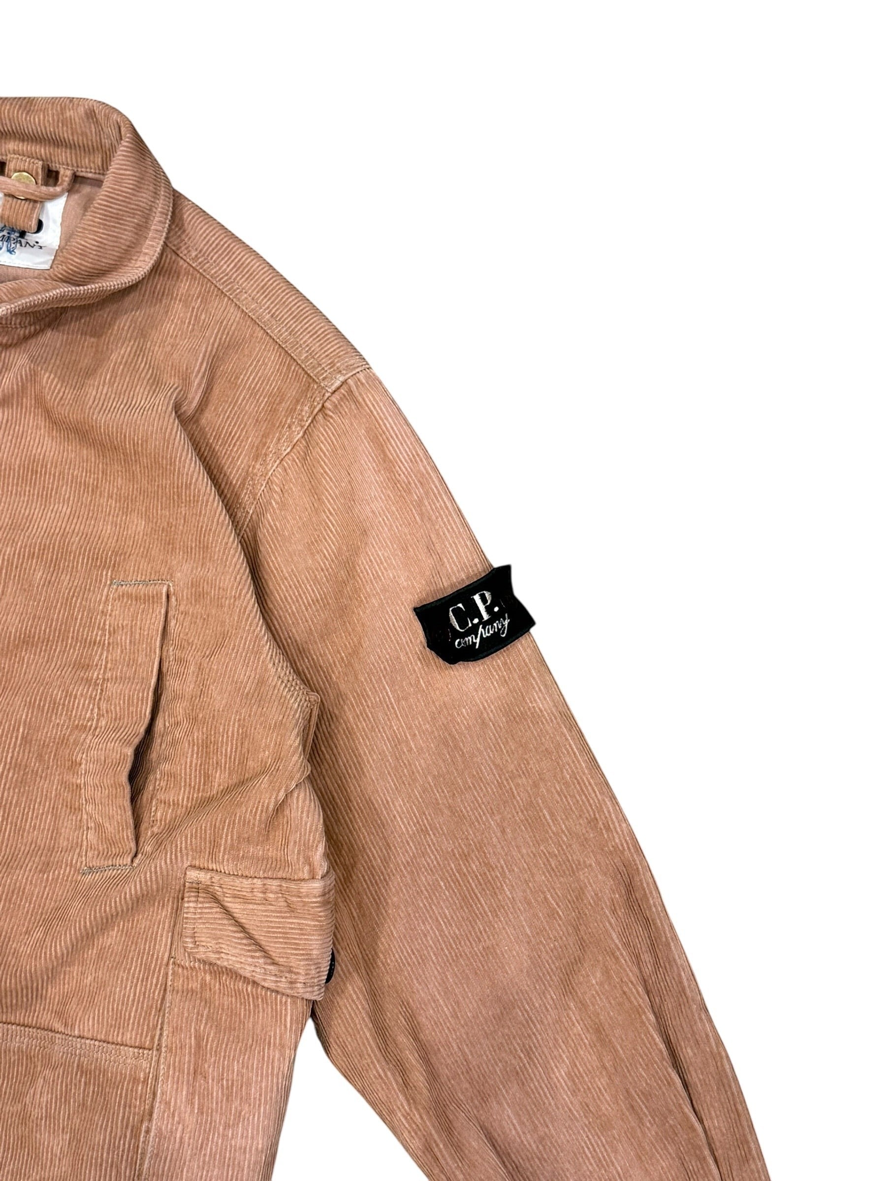 Archive No. 9 vintage pink corduroy jacket with C.P. Company logo patch on sleeve. Size Small.