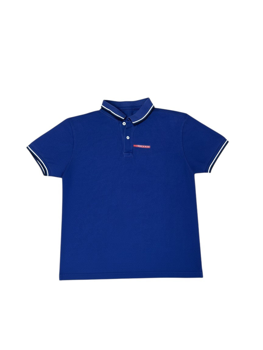 Archive No. 9 vintage navy blue 100% cotton Prada polo shirt with white and black trim on collar and sleeves, and Prada logo on chest. Size L.