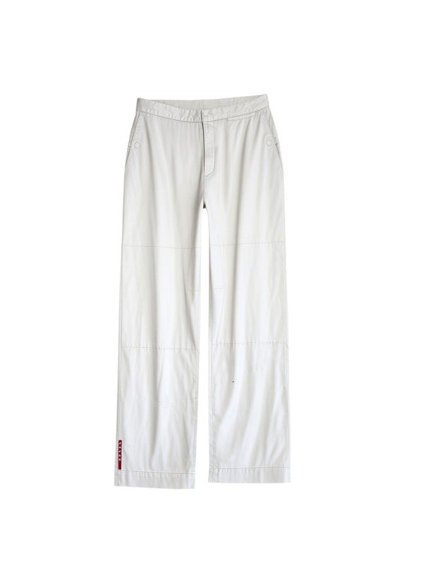 Archive No. 9 beige Prada Sport straight leg trousers with button pockets and iconic branding on the lower leg.