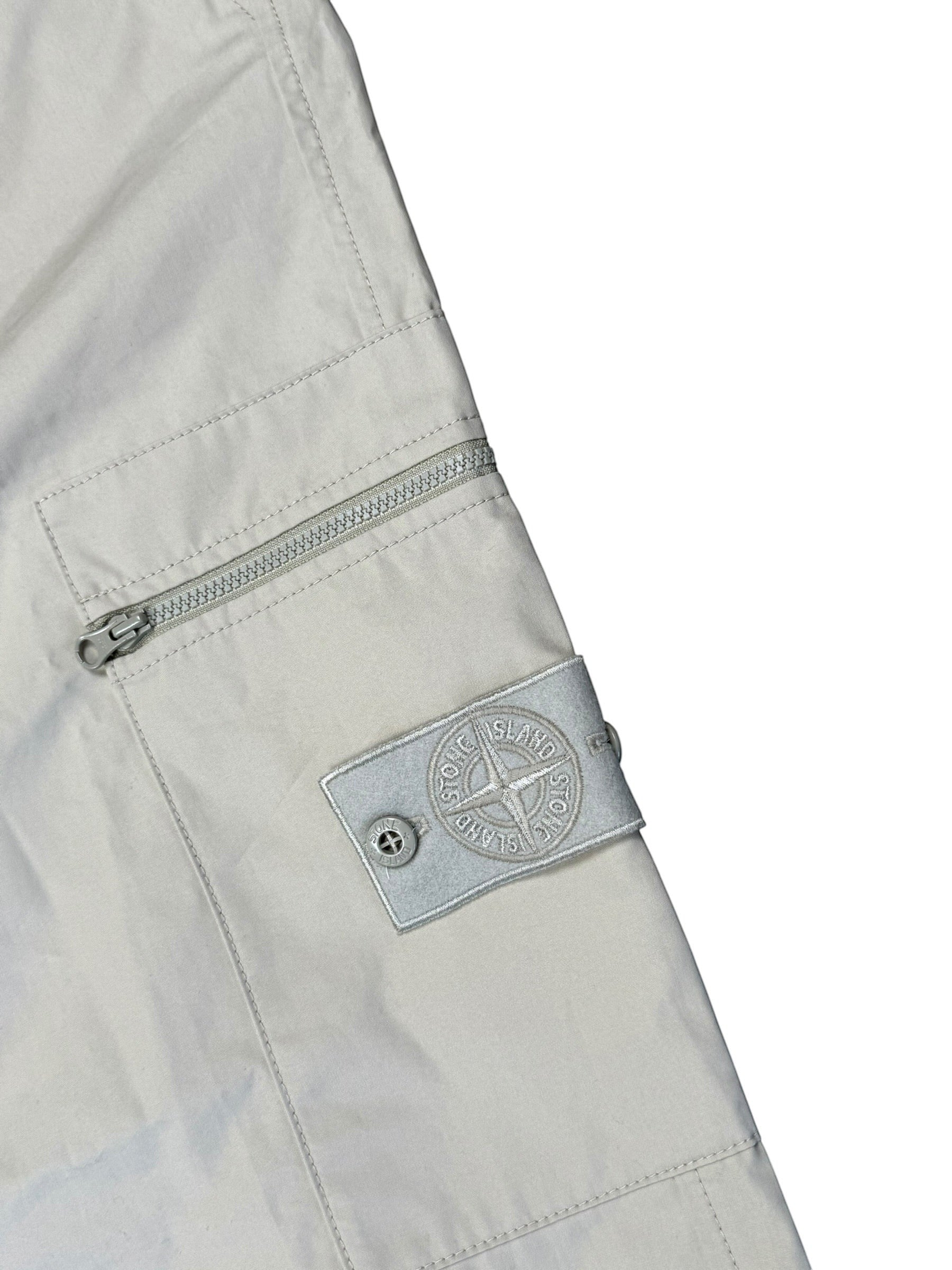 Archive No. 9 beige Stone Island Ghost cargo trousers, 100% cotton with zip pockets and iconic badge. Size W31.