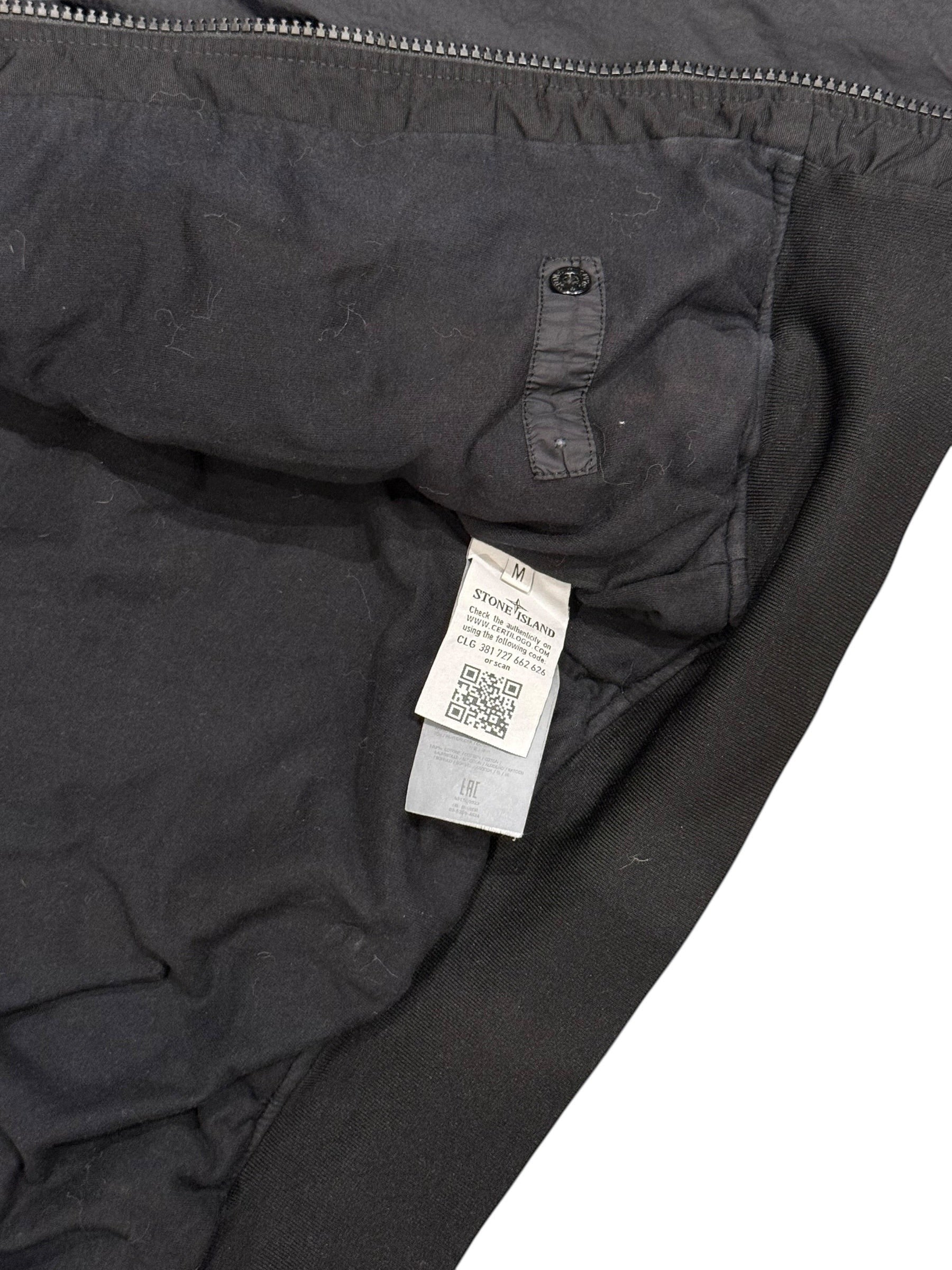 Archive No. 9 Stone Island black bomber jacket, size M. Features wind and water resistance, and a rare Shadow Project badge.