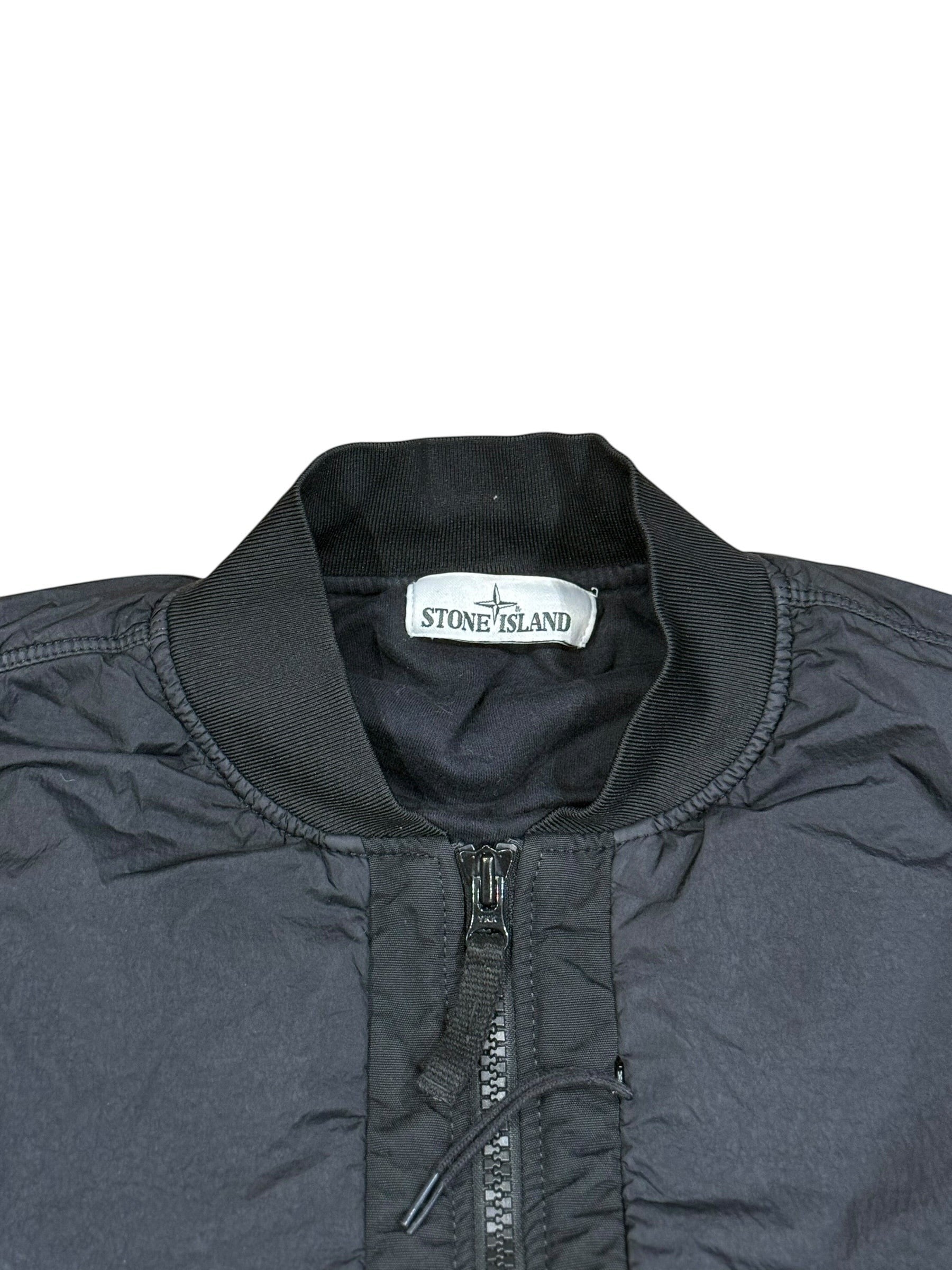 Archive No. 9 Stone Island black bomber jacket, size Medium. Features wind and water resistance, zip closure, and a rare Shadow Project badge.