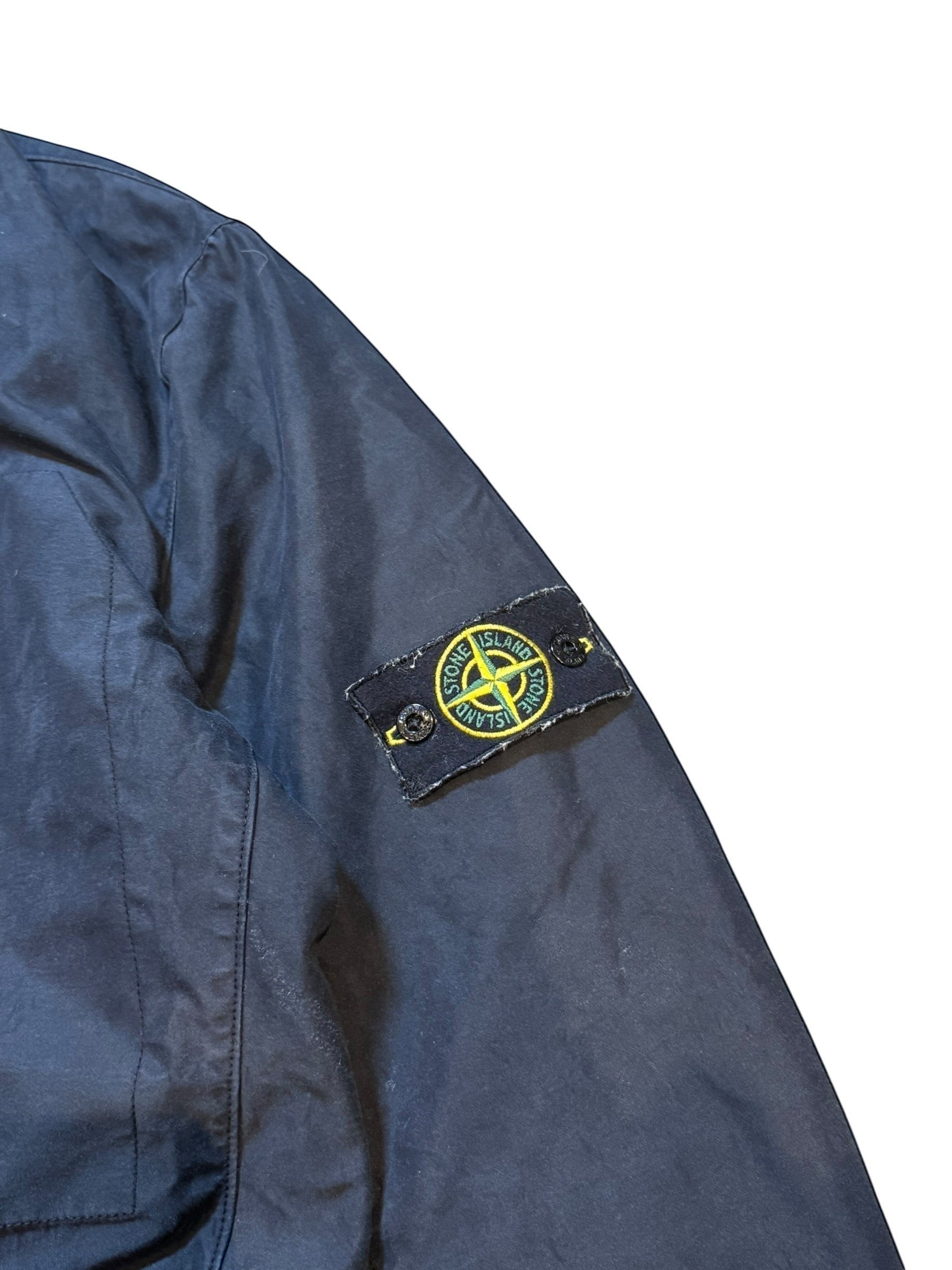 Archive No. 9 black Stone Island Harrington jacket with down filling and velvet lining. Classic outerwear piece.