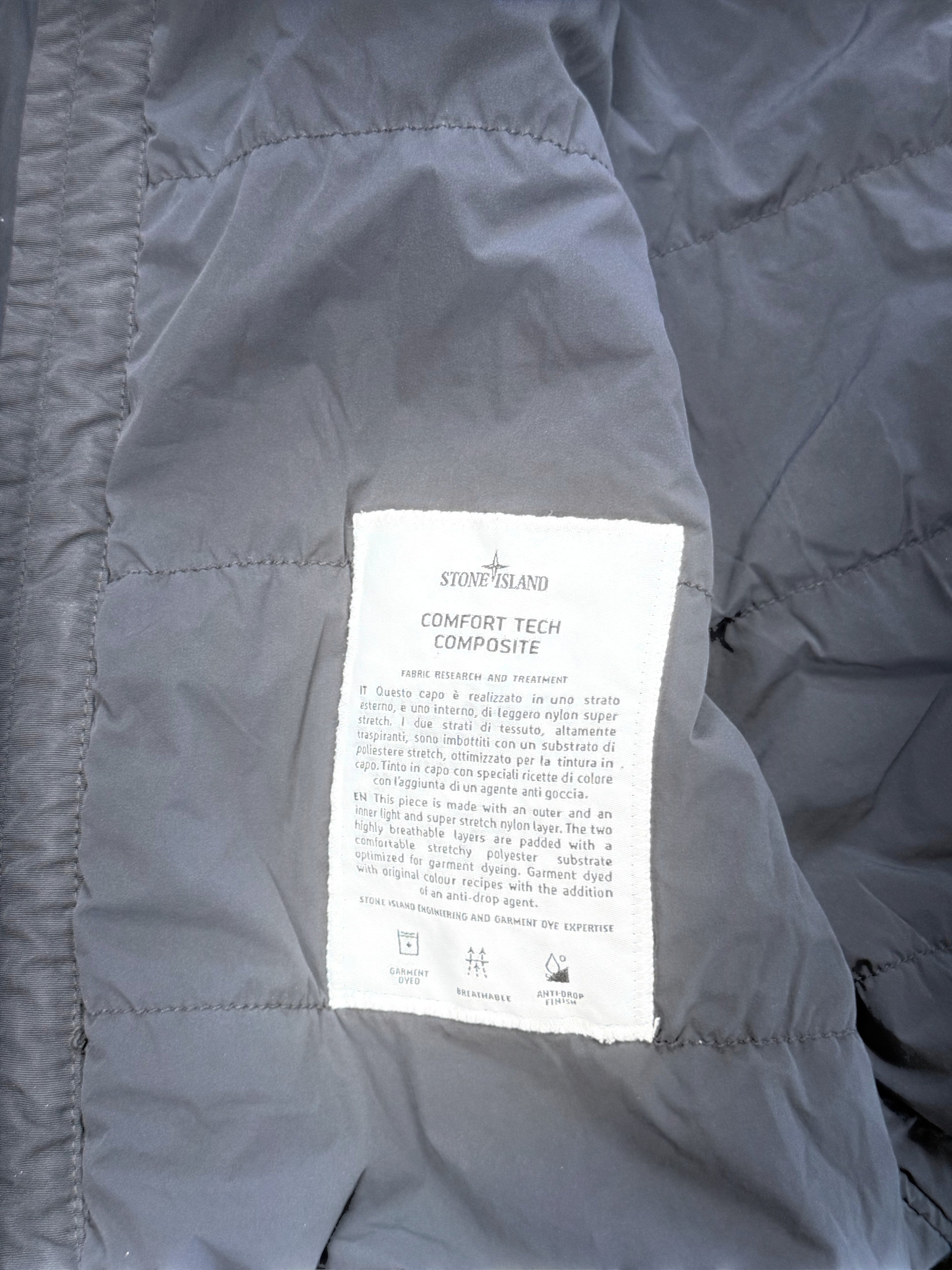Archive No.9 black Stone Island Comfort Tech Composite jacket with elasticated cuffs and waist, made from lightweight stretchy material.