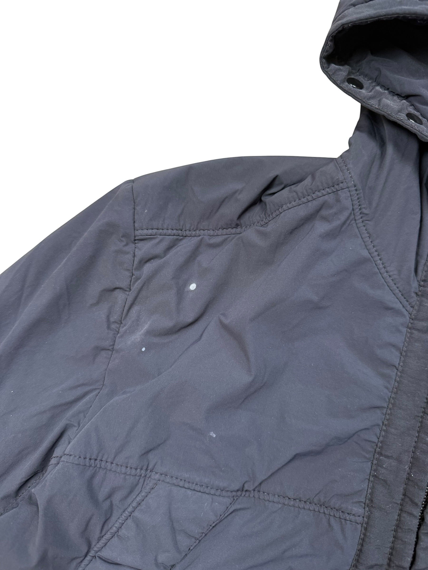 Archive No. 9 black Stone Island Comfort Tech Composite Jacket with elasticated cuffs and hood. Features lightweight stretchy material.