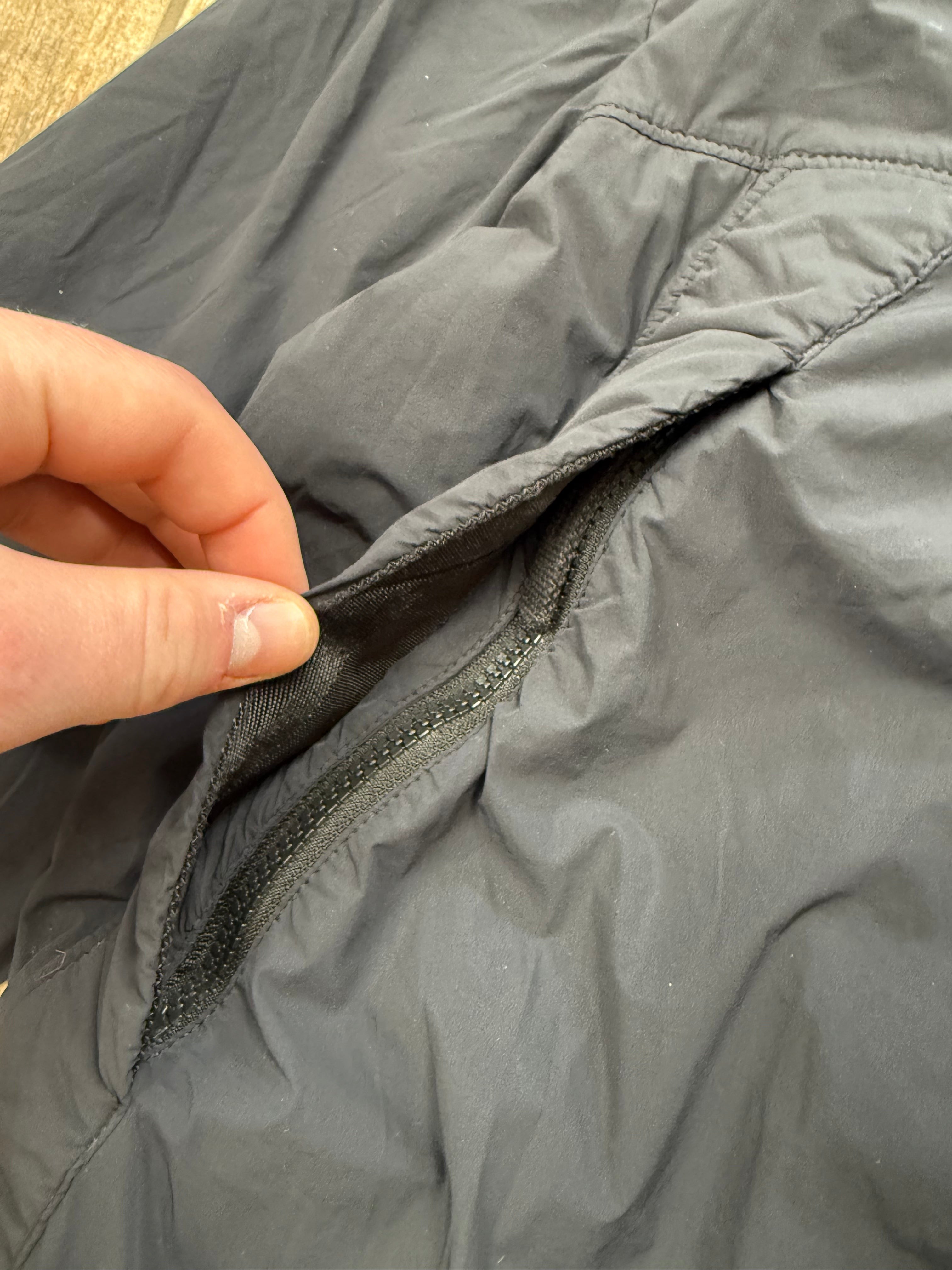 Archive No.9 black Stone Island Comfort Tech Composite Jacket, size M, featuring a zippered pocket and elasticated cuffs.