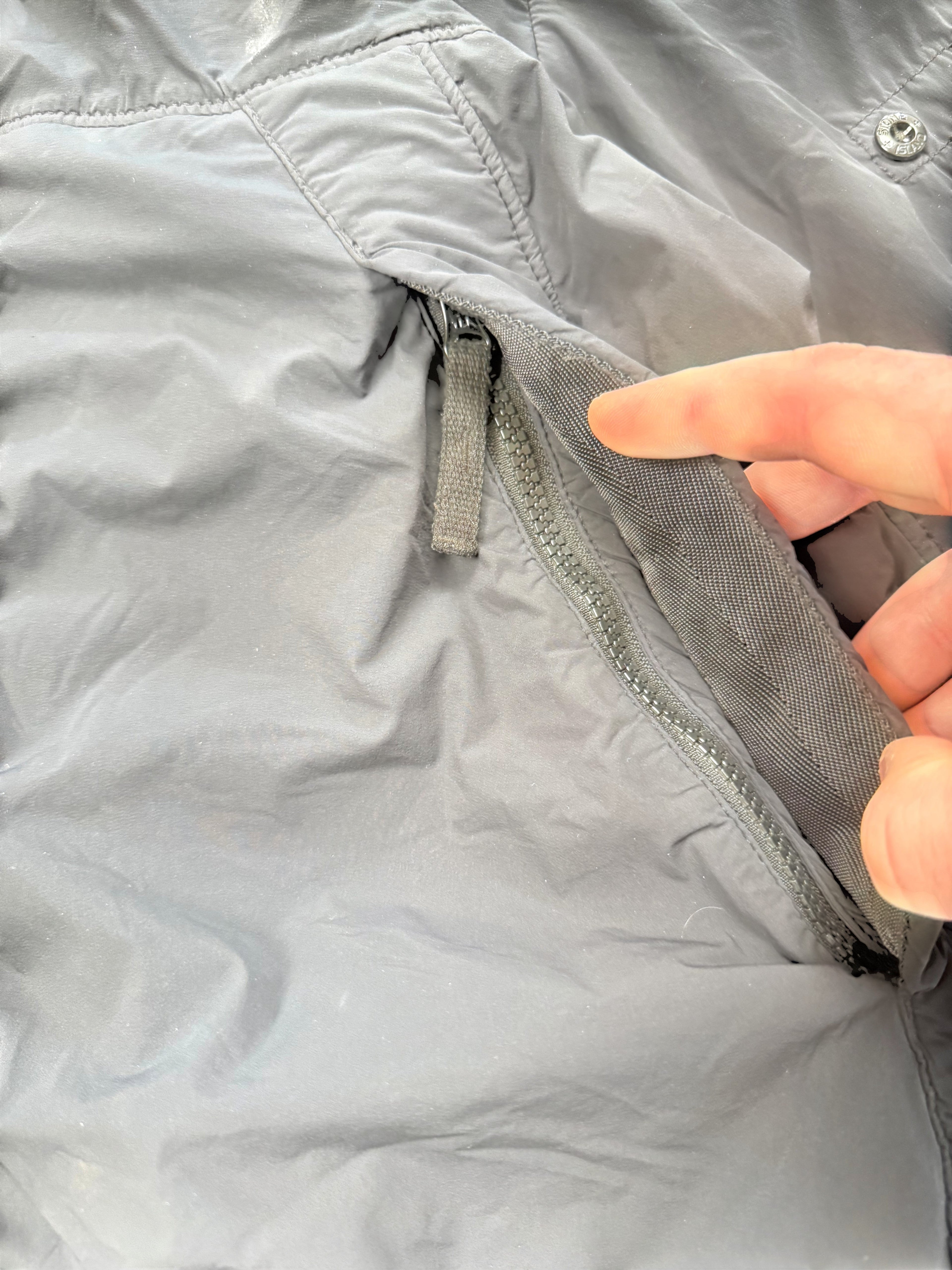 Archive No.9 black Stone Island Comfort Tech Composite Jacket, size M, with zip pocket and elasticated cuffs.